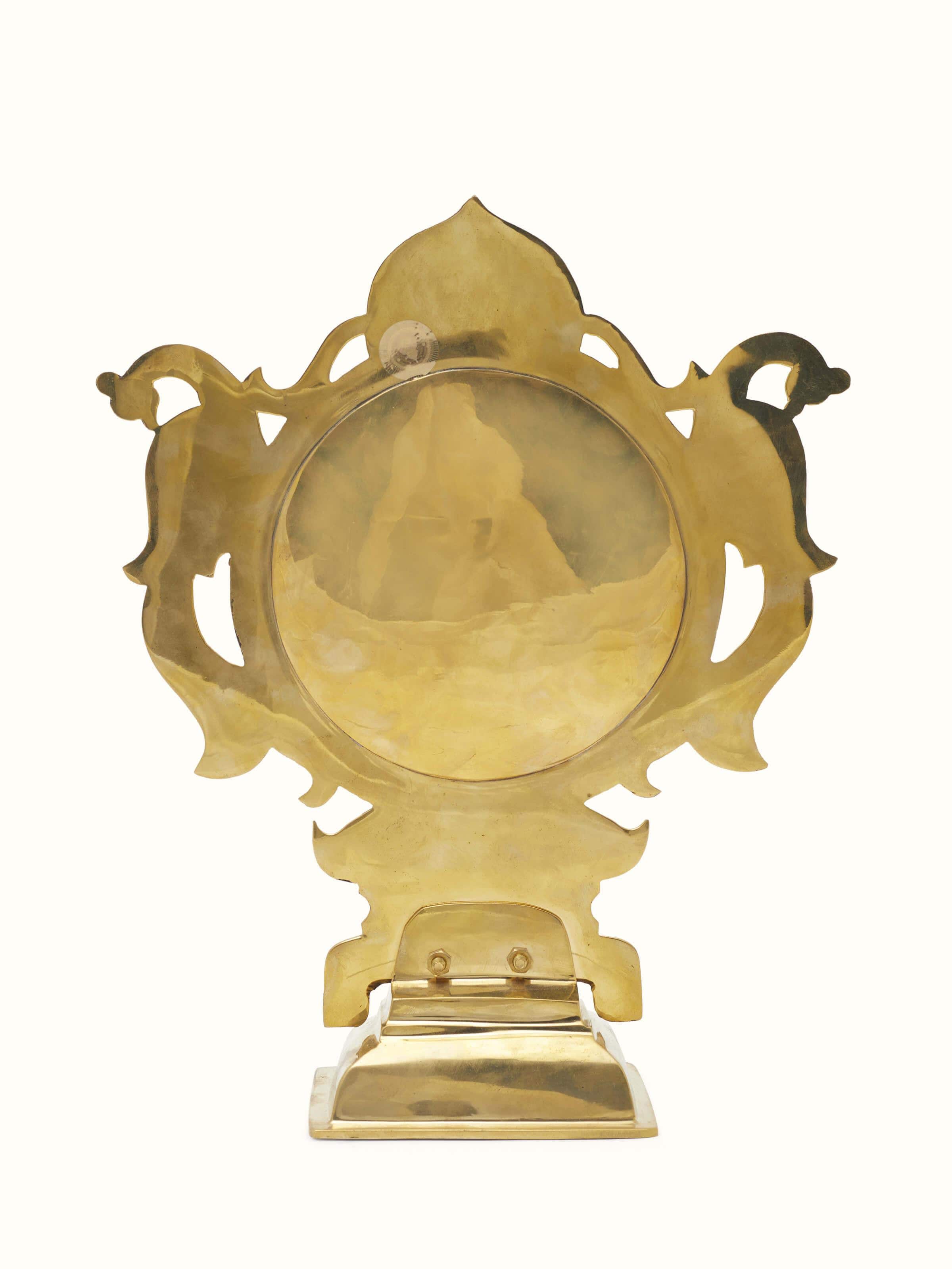 Side view of Traditional Aranmula Kannadi brass mirror revealing the elegant profile and reflective quality