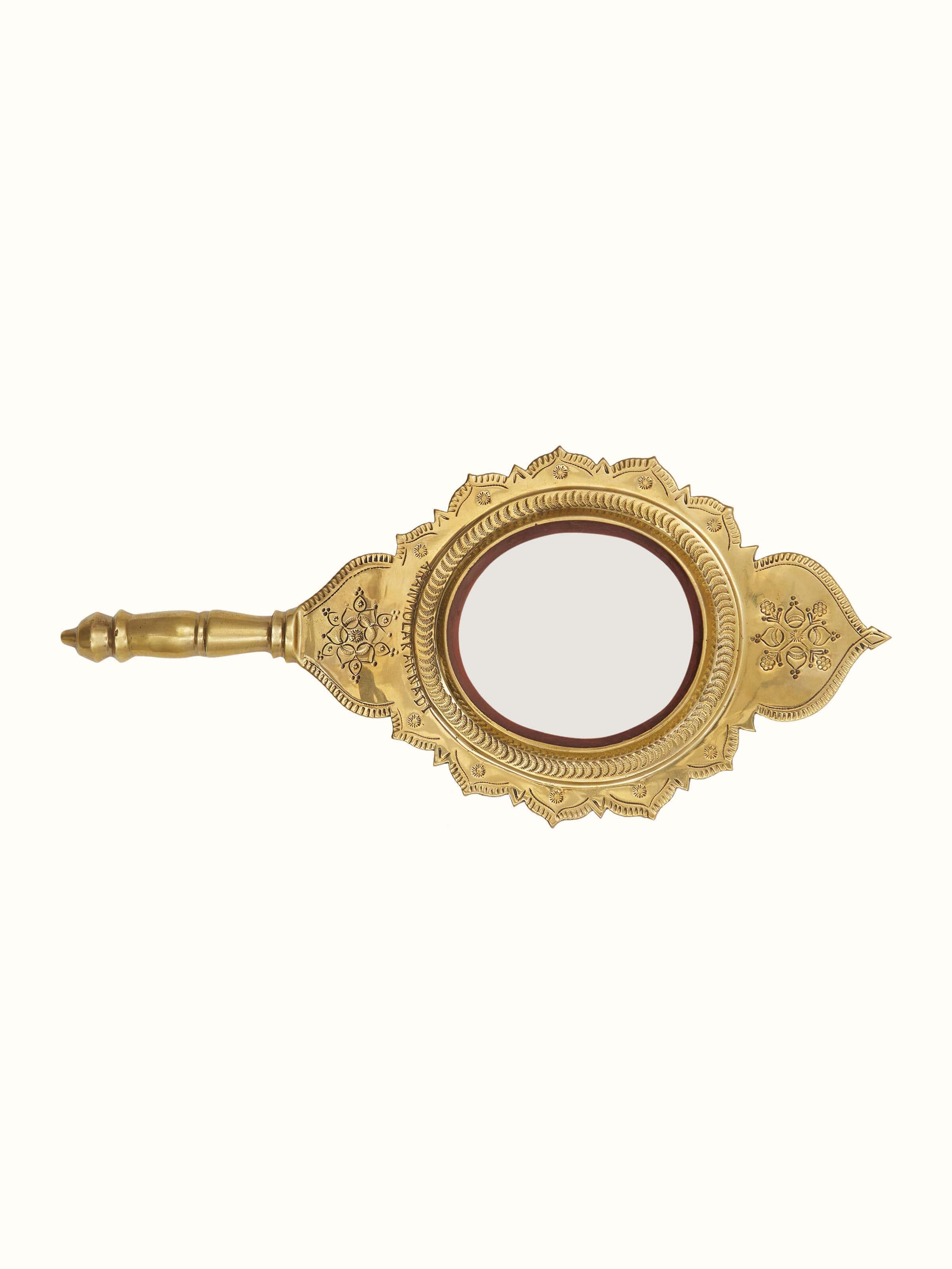 Side view of Transitional Aranmula Kannadi brass mirror highlighting its elegant frame and intricate design