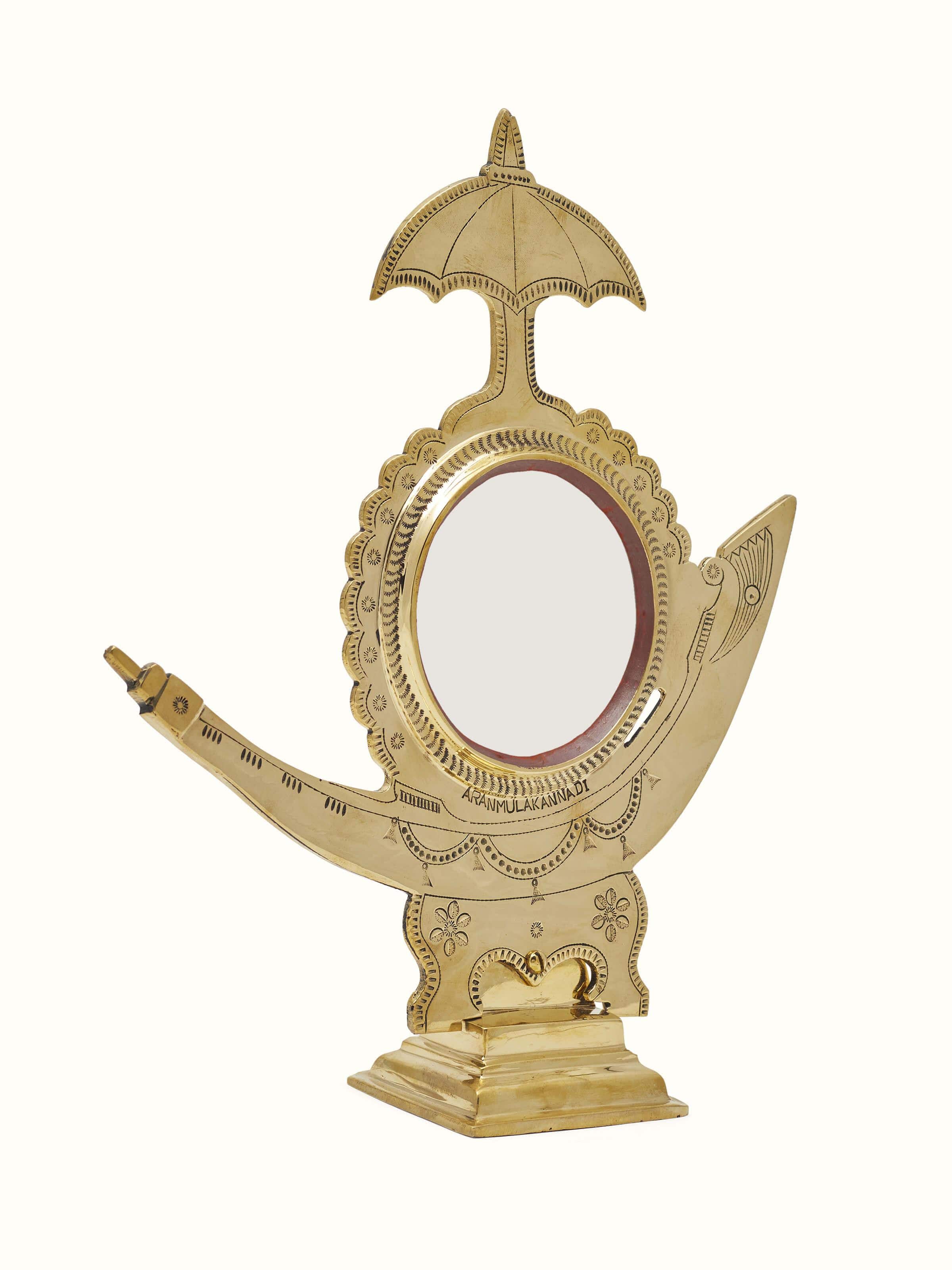 Angled view of Aranmula Kannadi Brass Mirror showing detailed reflections