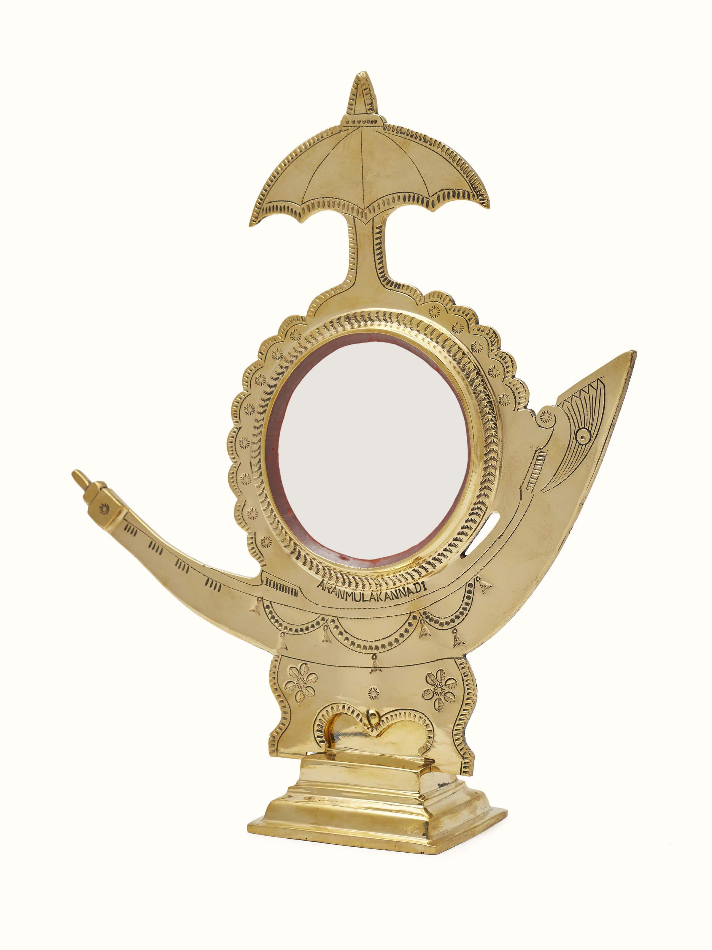 Close-up of Aranmula Kannadi Brass Mirror focusing on the mirror's clarity and frame