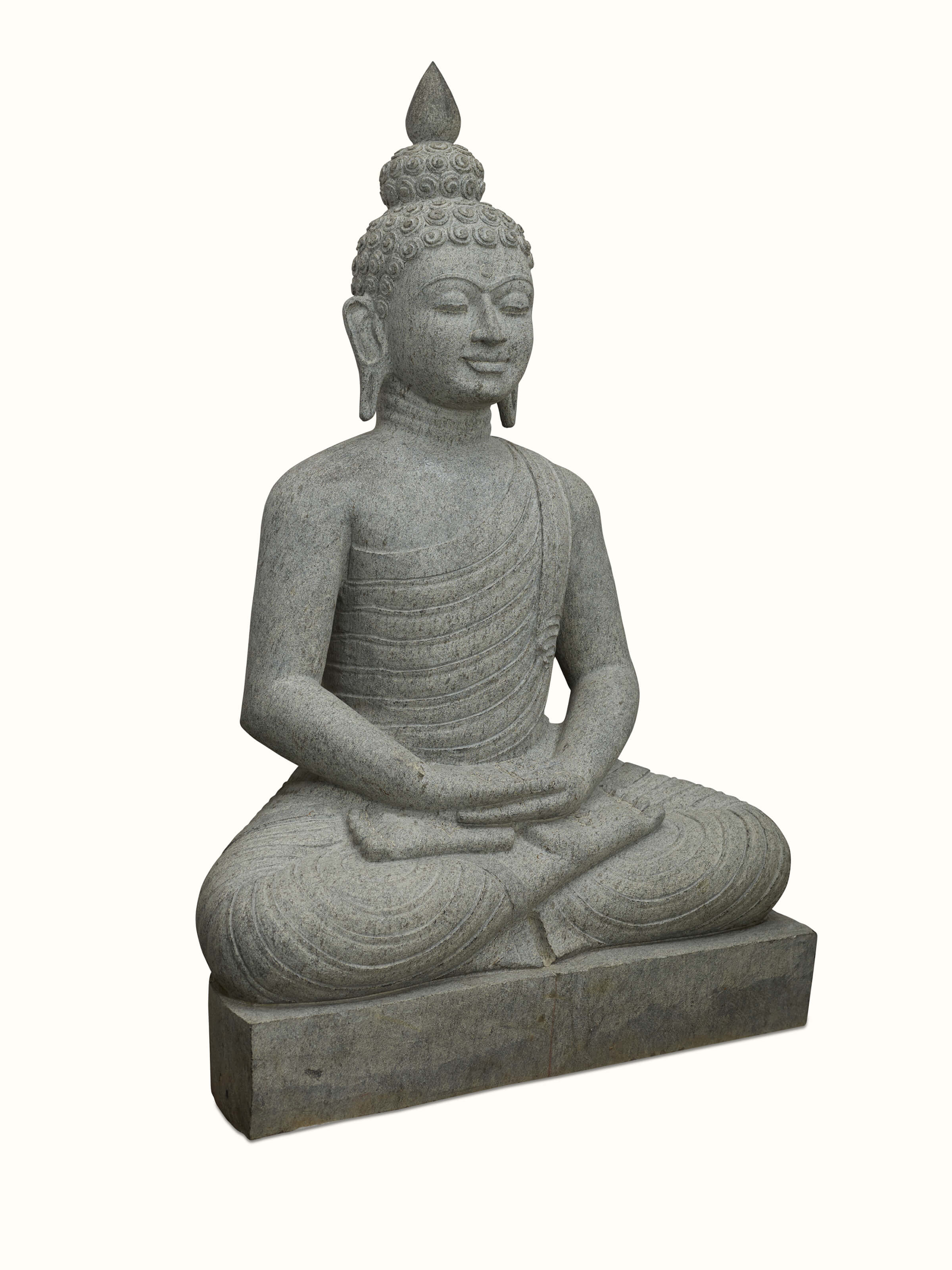 Close-up view of Meditating carved stone Buddha idol focusing on detailed facial features and craftsmanship.