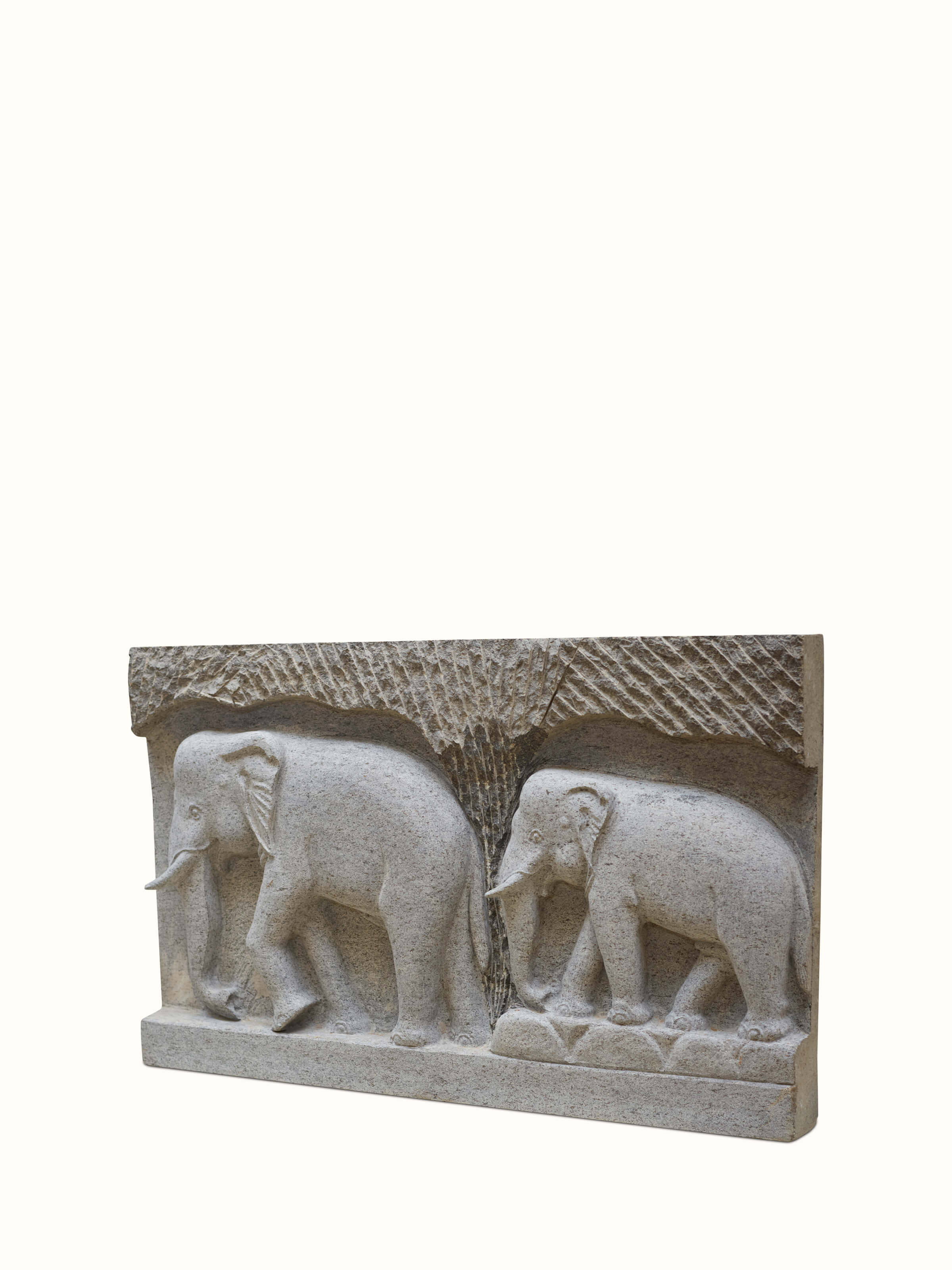 Side view of Magnificent carved stone elephant panel sculpture emphasizing the fine carving details and grandeur
