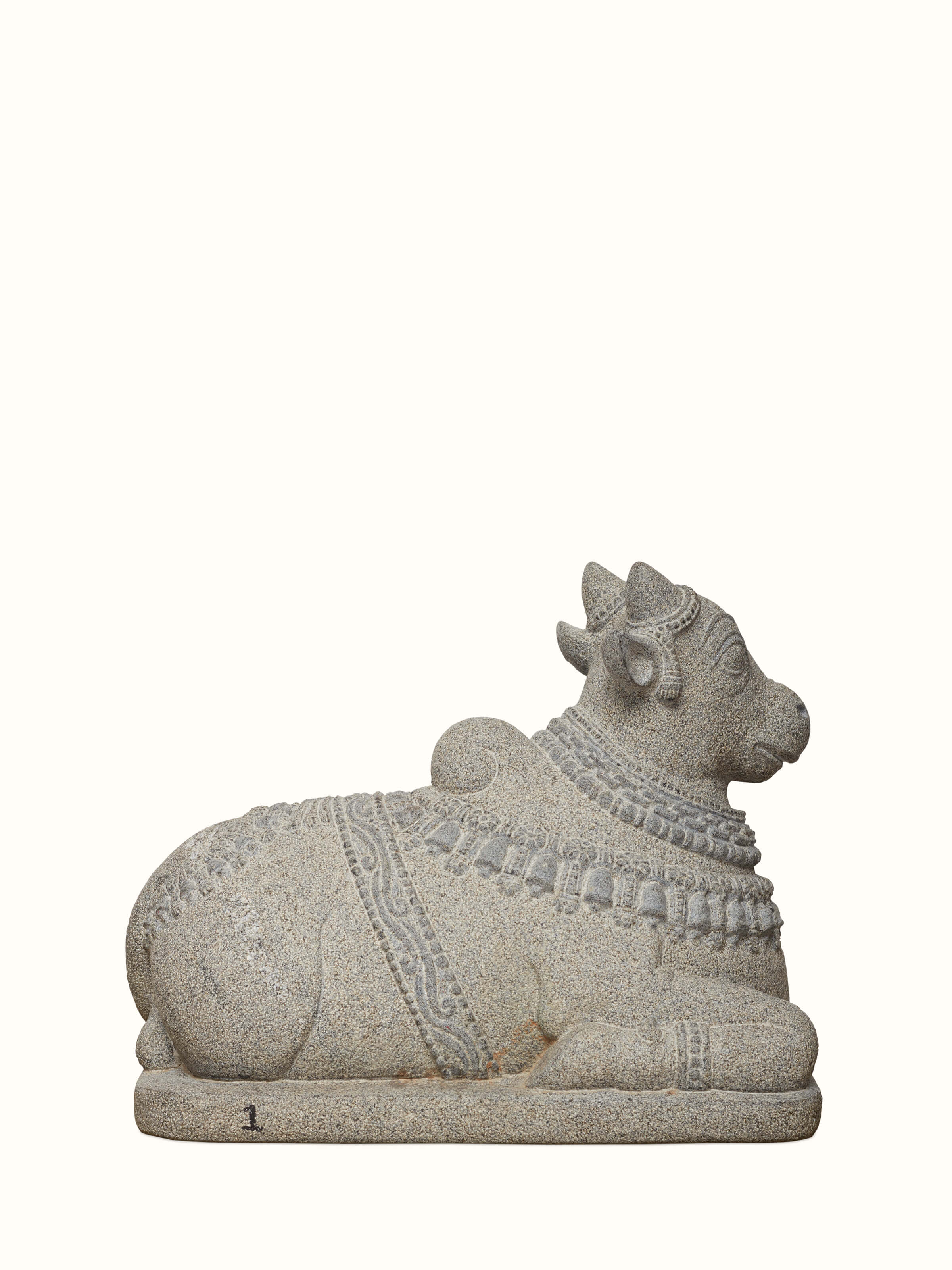 Angled view of Majestique carved stone adi nandi sculpture highlighting intricate stonework and design