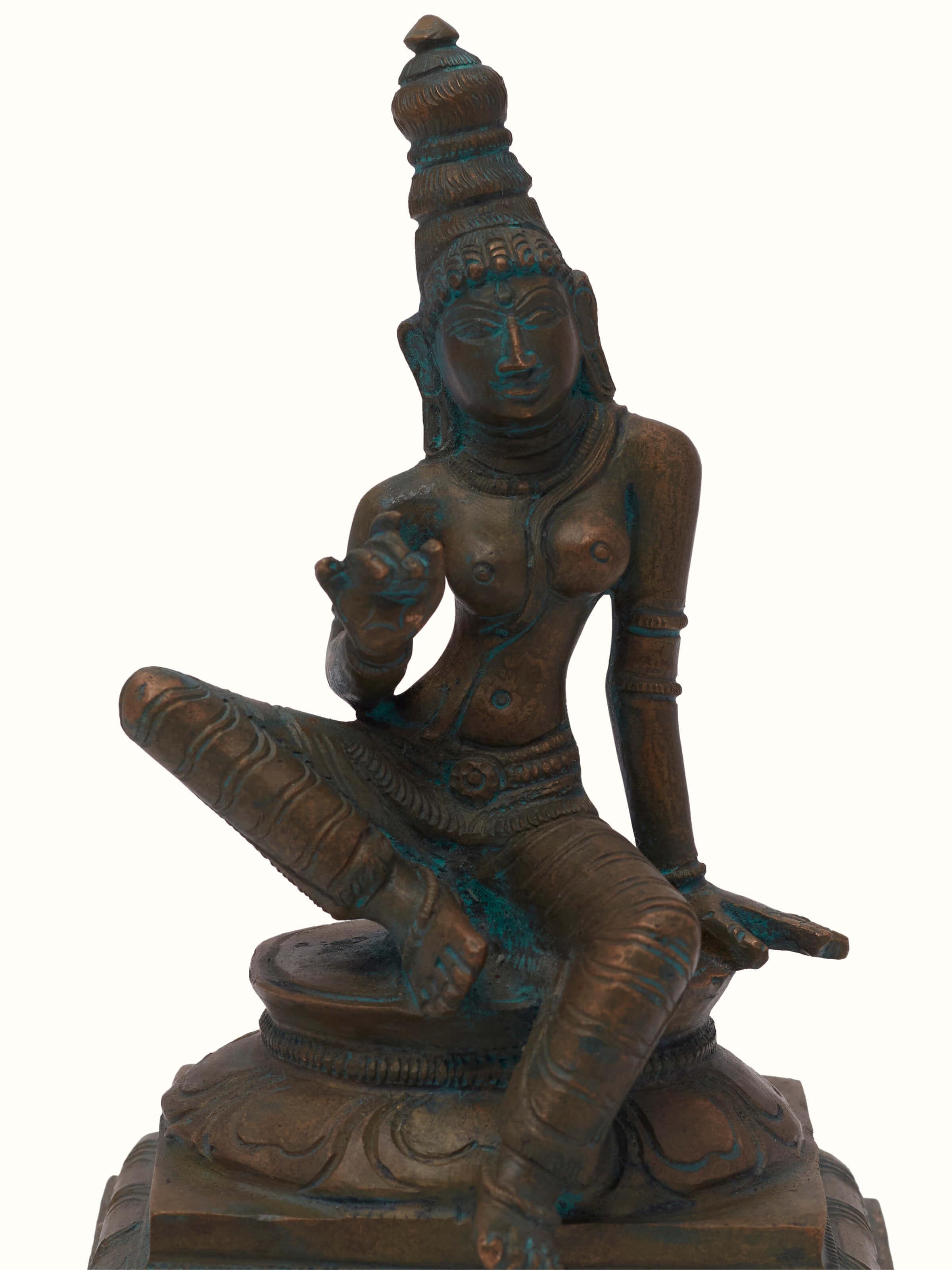 Detailed view of antique bronze casting boga Sakthi idol, highlighting fine details