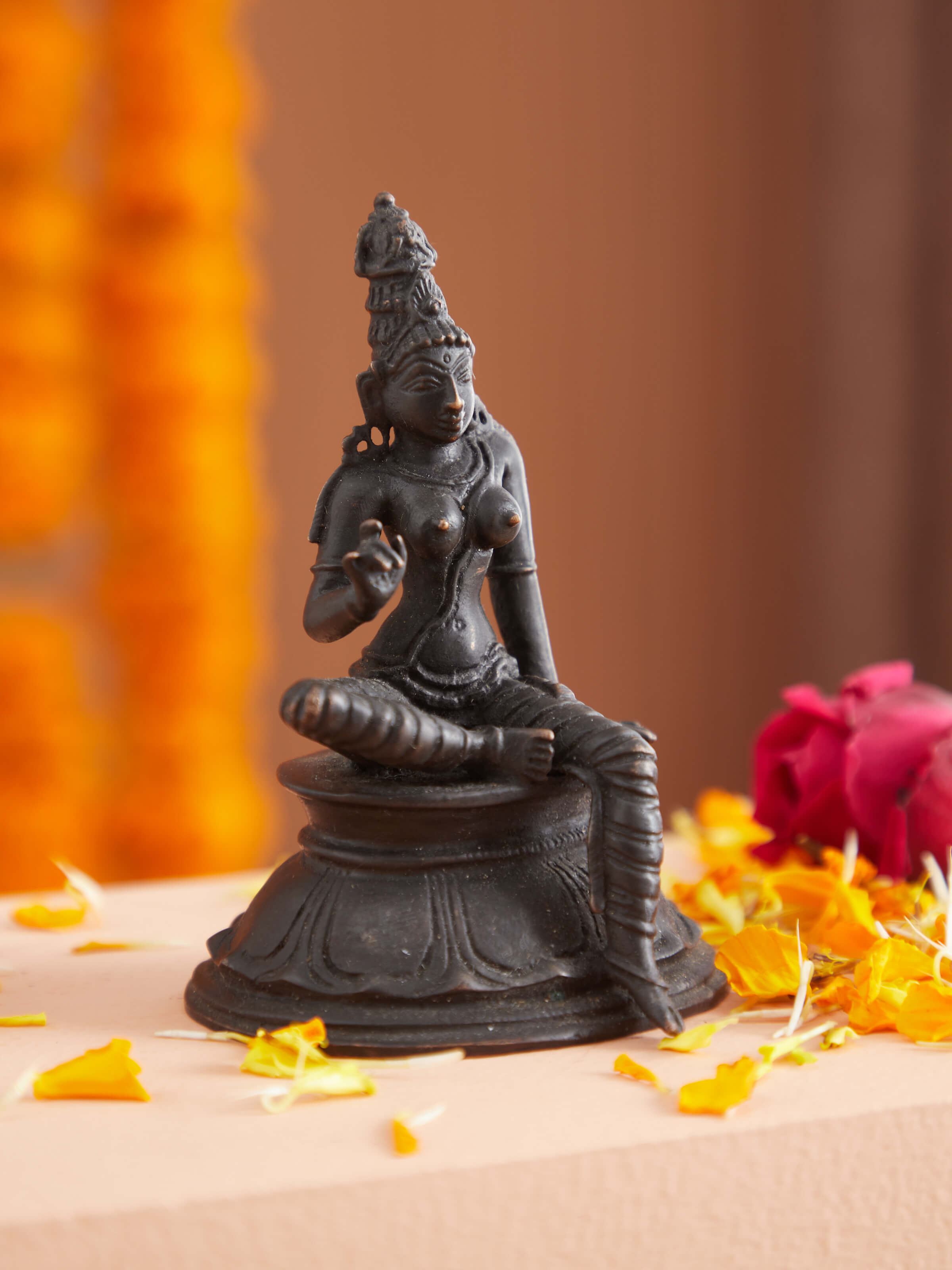 Side view of pristine bronze casting Boga Sakthi idol showing intricate design