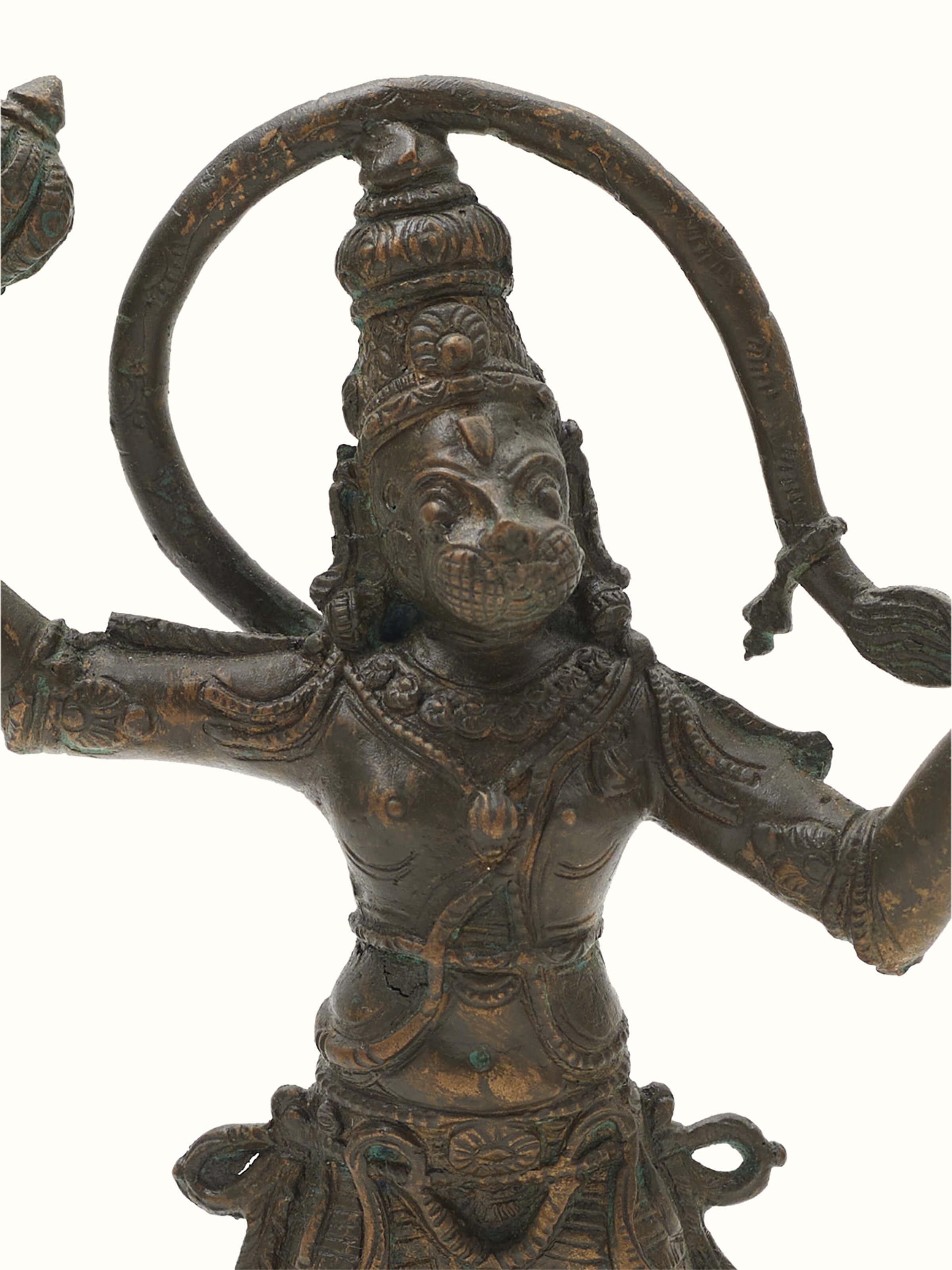 Close-up view of Anjaneyar with Sanjeevani Bronze Casting Idol focusing on facial features and intricate bronze detailing