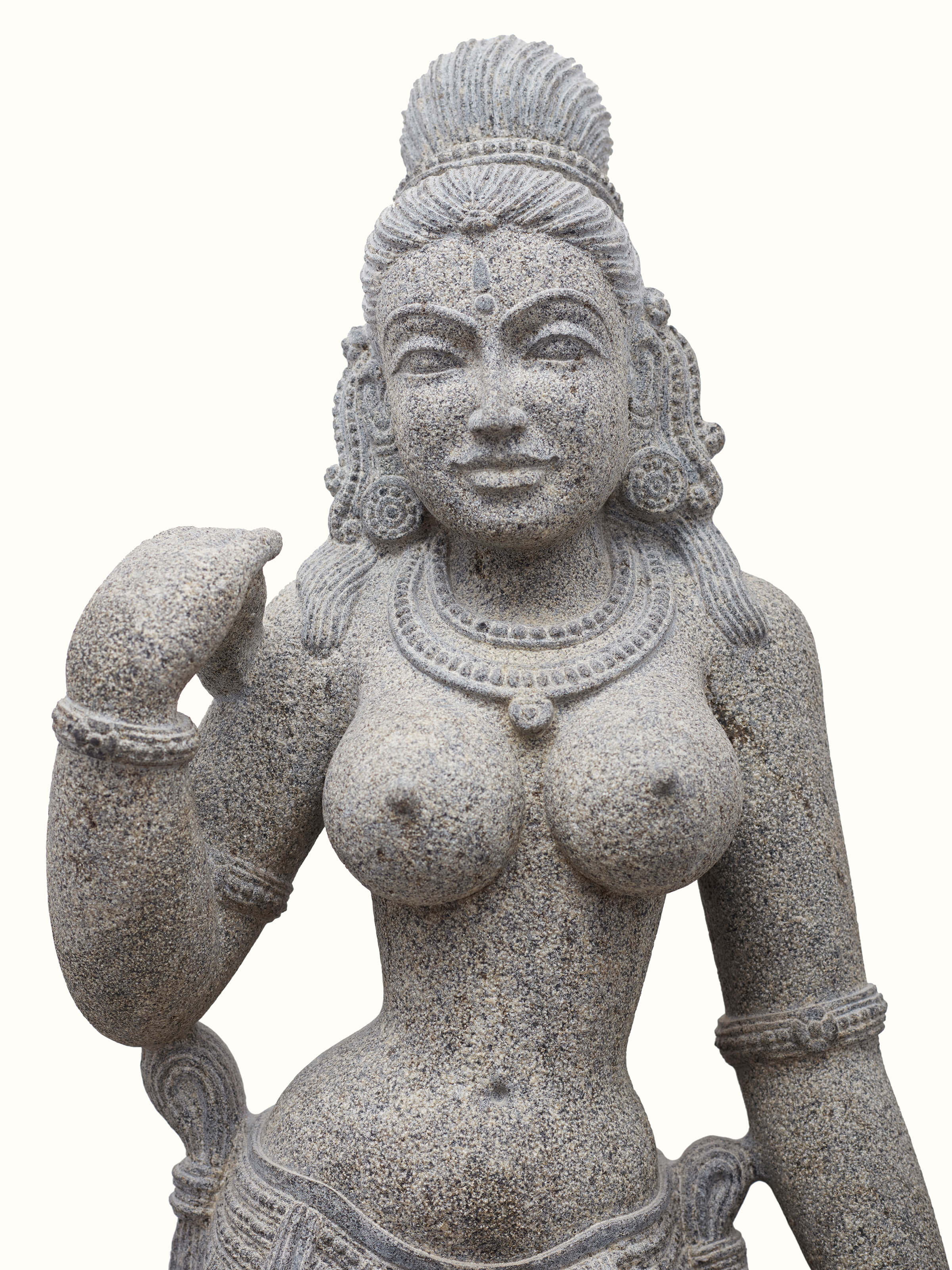 Detailed view of Deviji Stone Idol, focusing on the facial features and masterful stone craftsmanship.