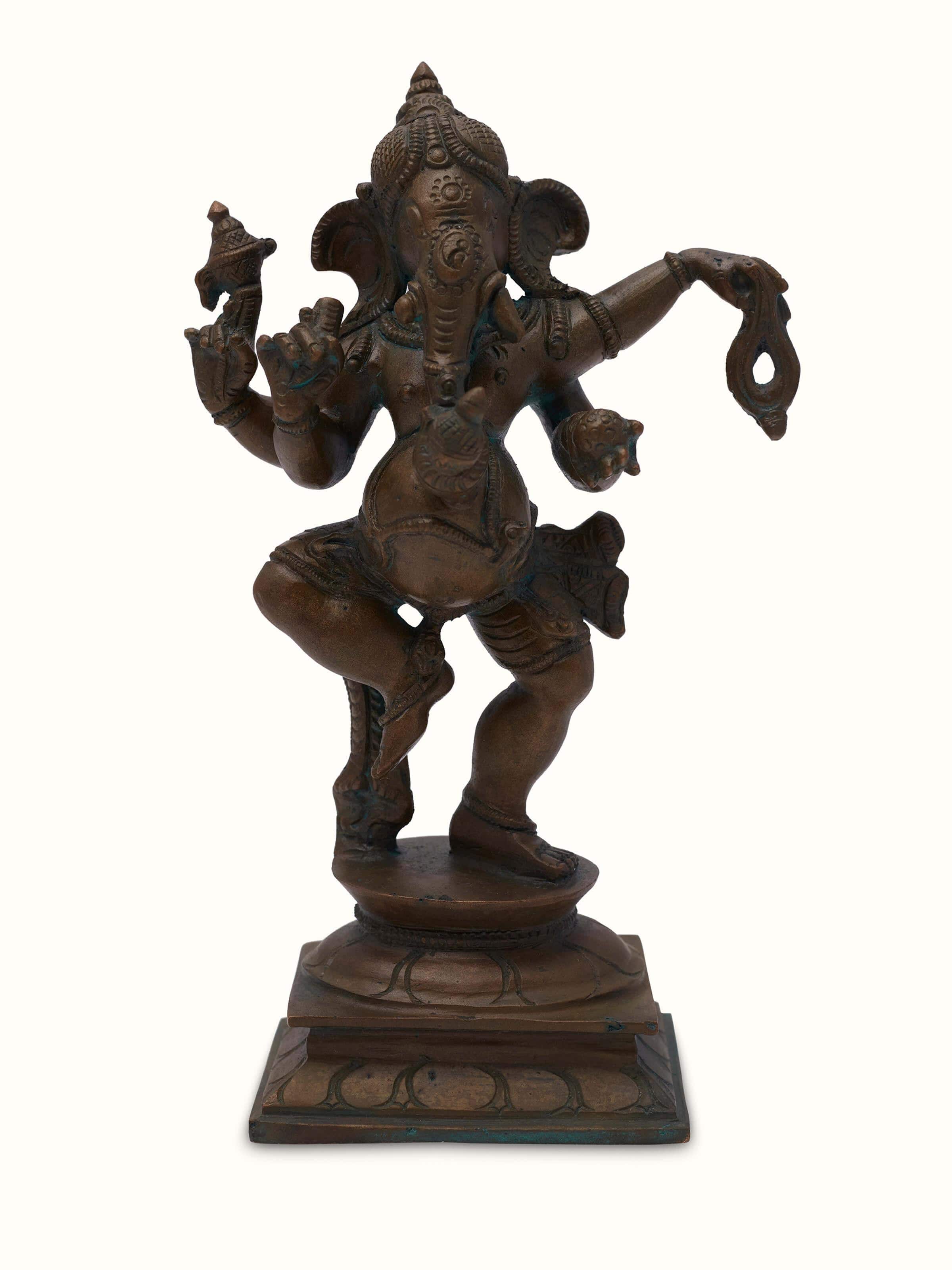 Front view of bronze casting dancing Ganesha idol showcasing its detailed craftsmanship and dynamic pose
