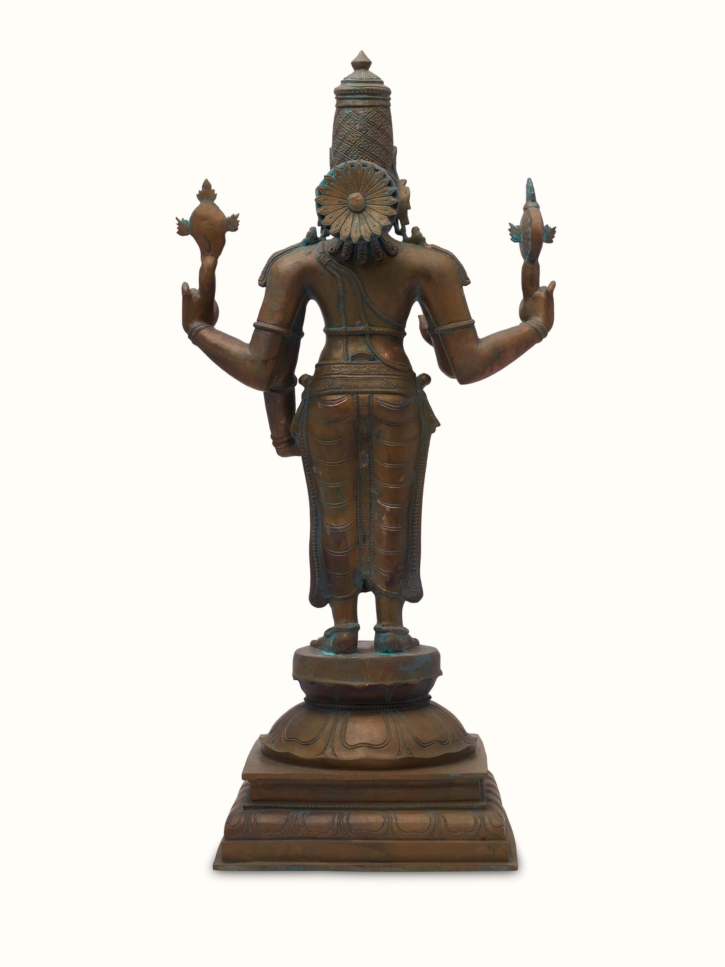 Detailed side view of Magnificent bronze casting Vishnu idol showcasing detailed design elements