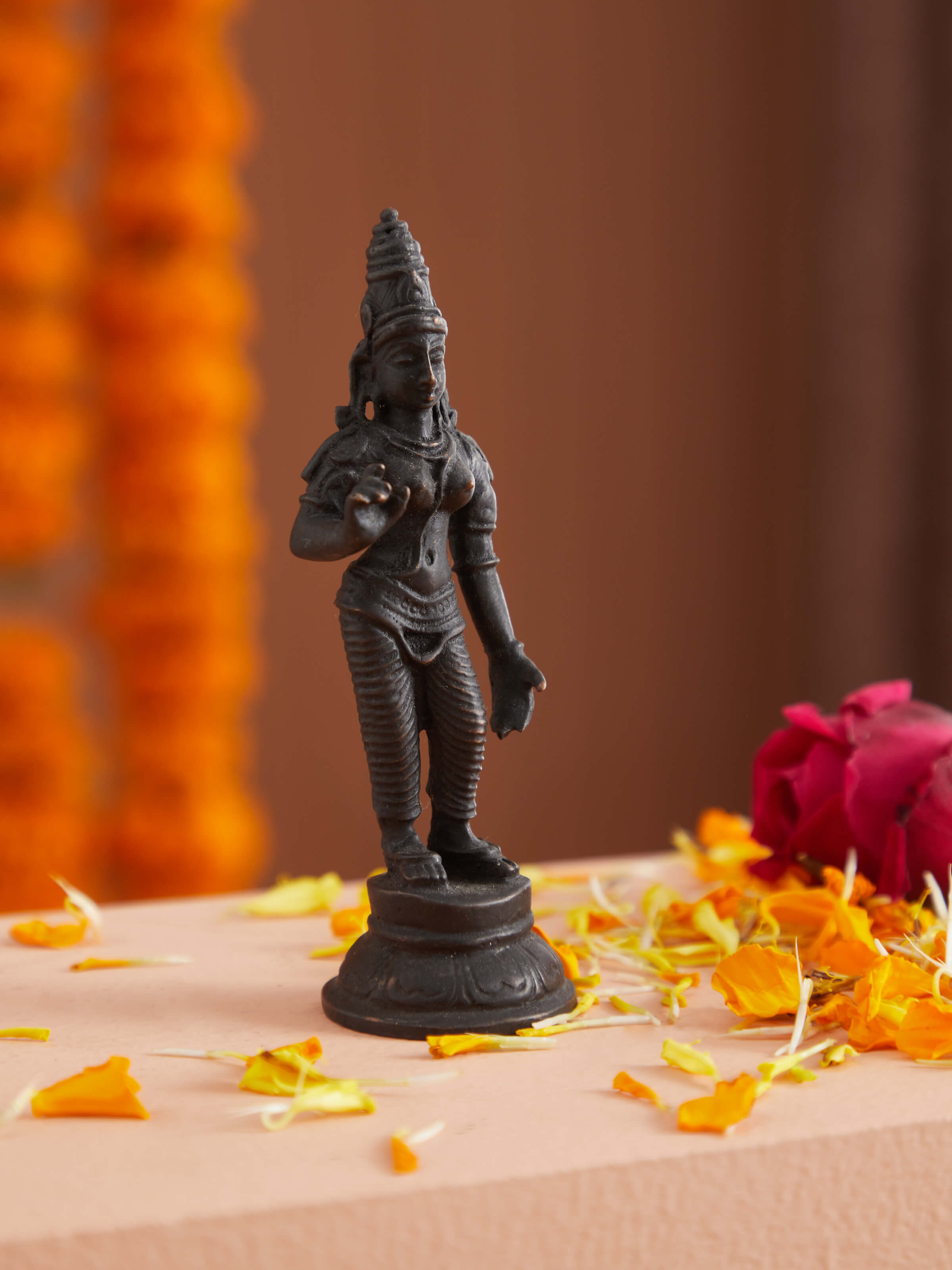 Close-up view of Goddess Parvathi bronze idol, showcasing its intricate details and craftsmanship.
