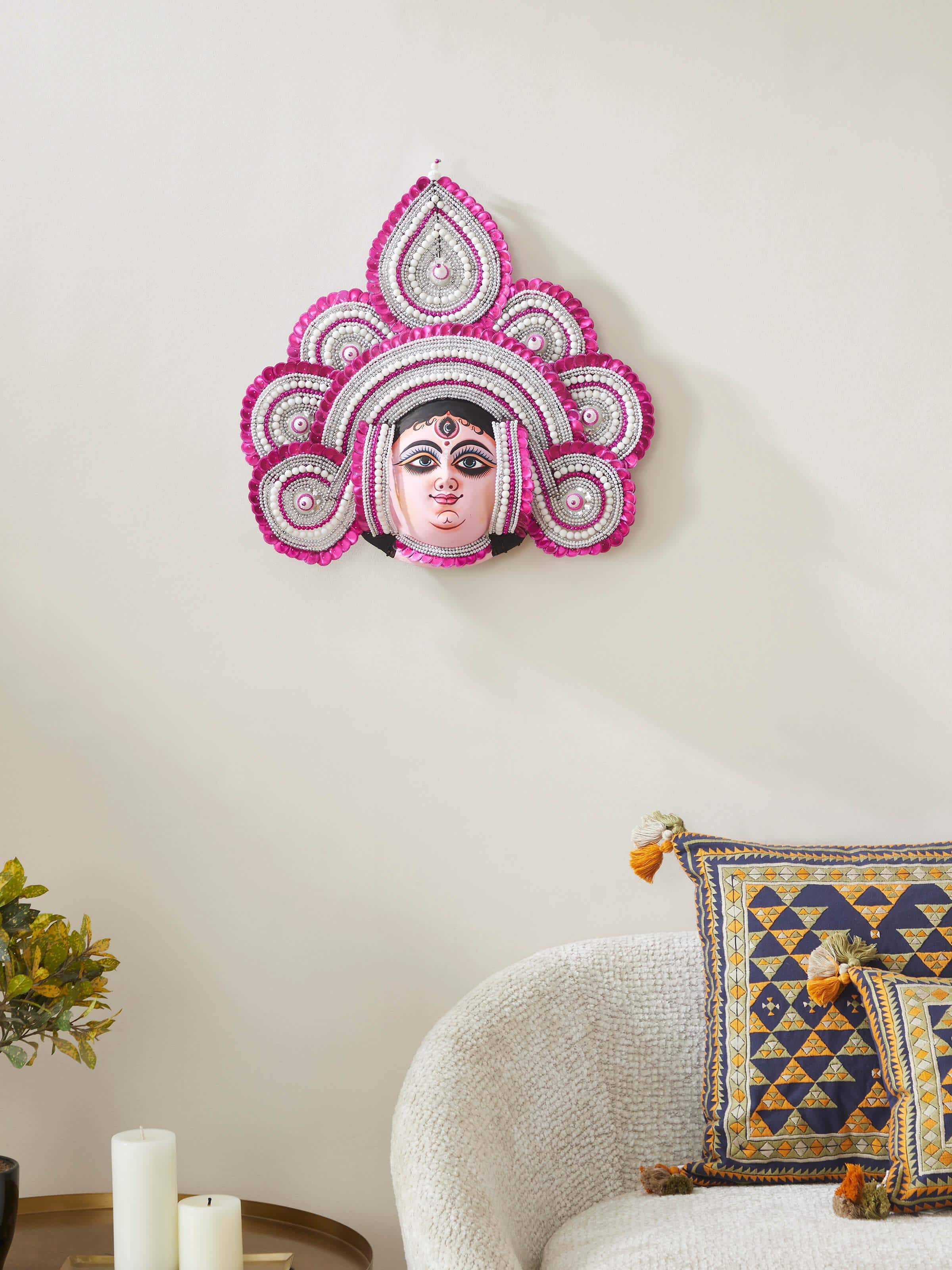 Side view of Pink Chhau Clay & Paper Goddess Durga Wall Mask highlighting the mask’s texture and shape.