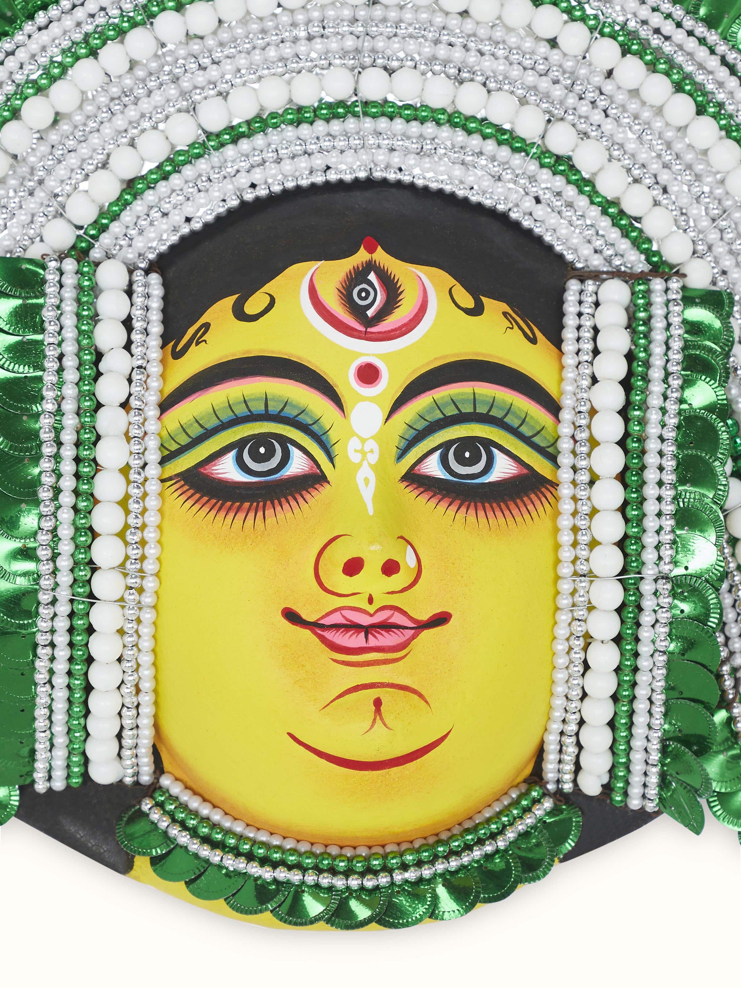 Detailed view of green chhau clay and paper goddess Durga wall mask showcasing its artistic design.