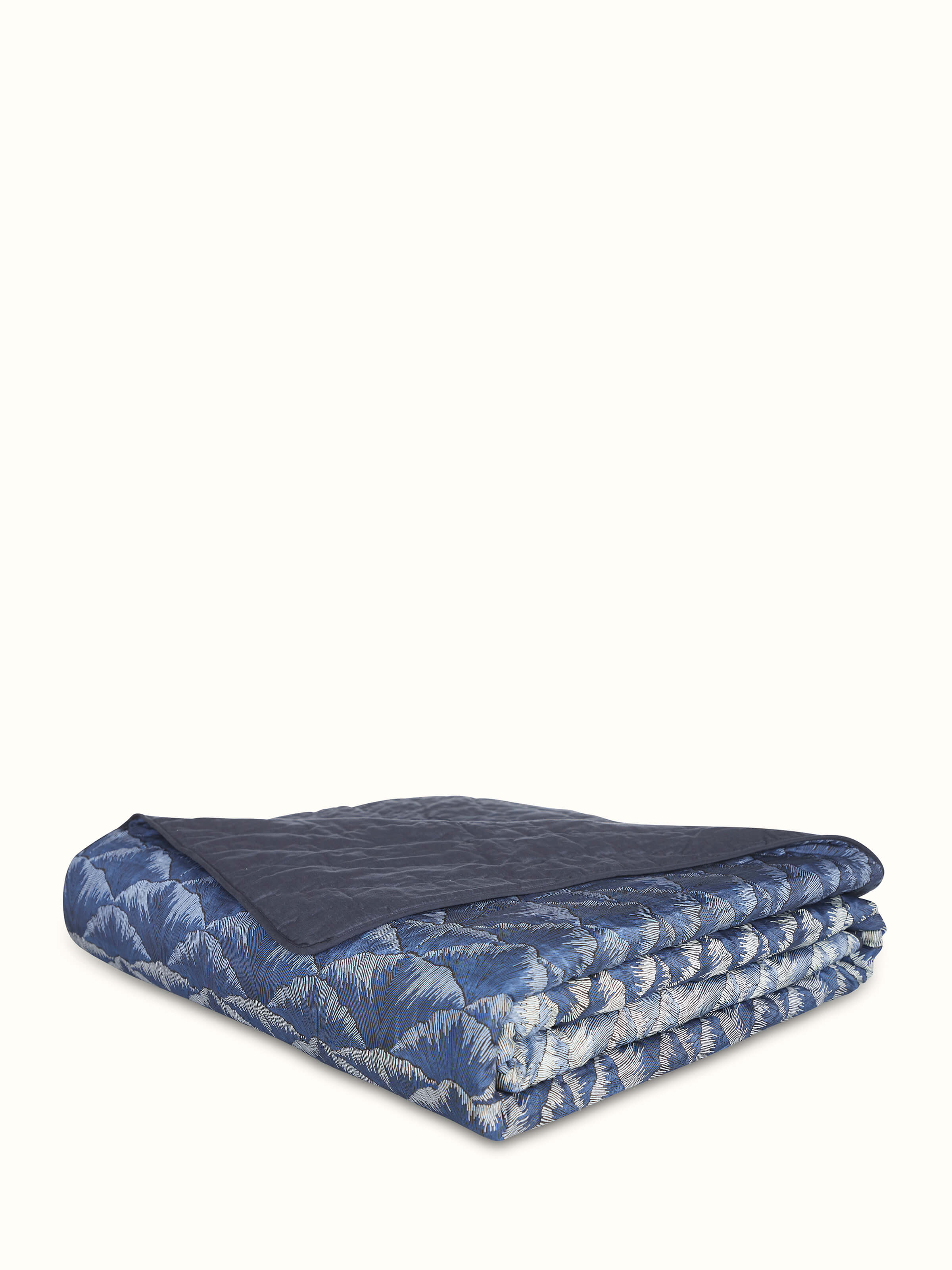 Detailed image showing the ombre effect and block print on the Parvat silk quilt