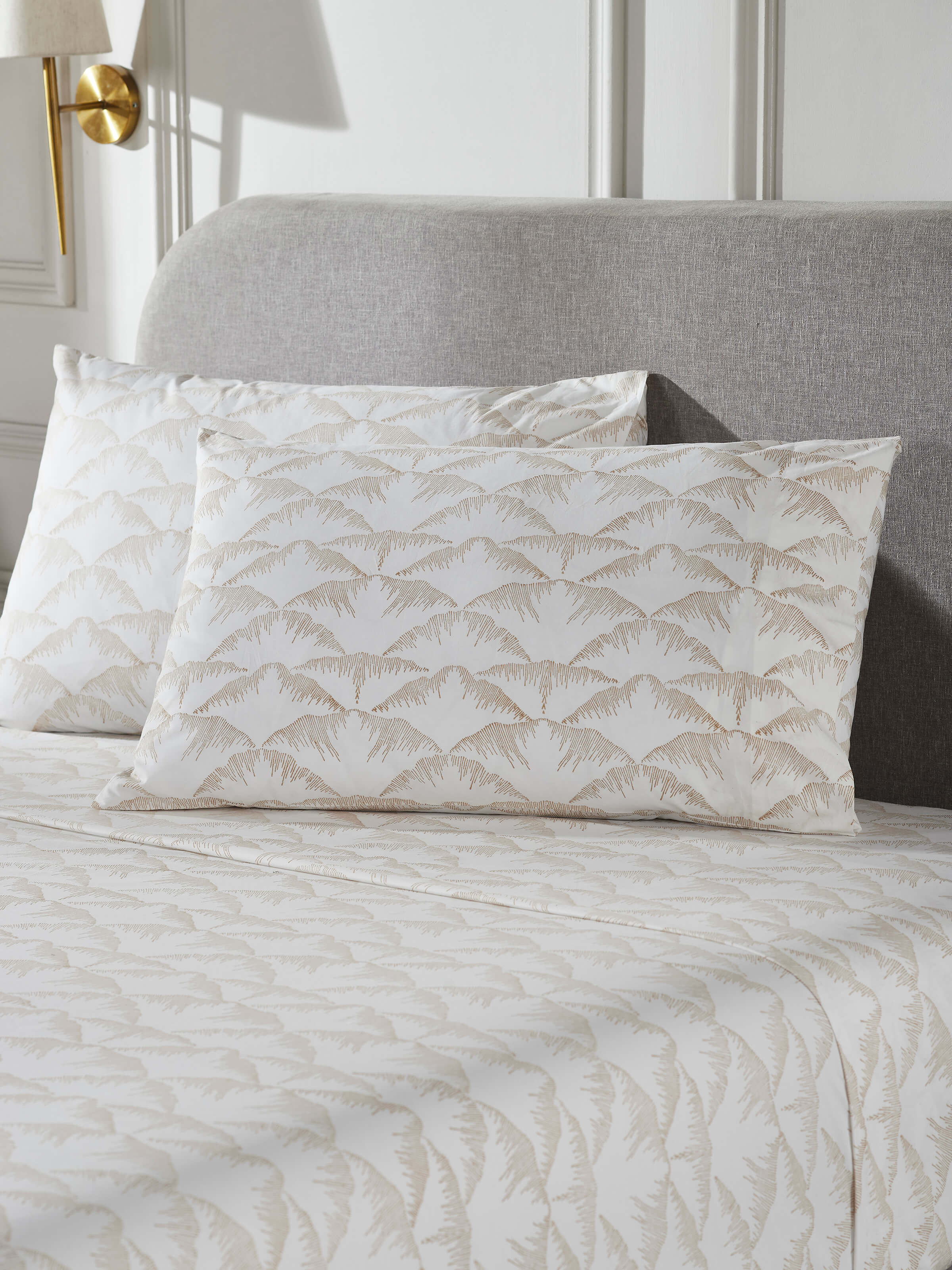 Close-up of Parvat beige textured cotton Sanganeri block printed queen bedsheet set (3 pcs) showing the fabric texture and block print details.