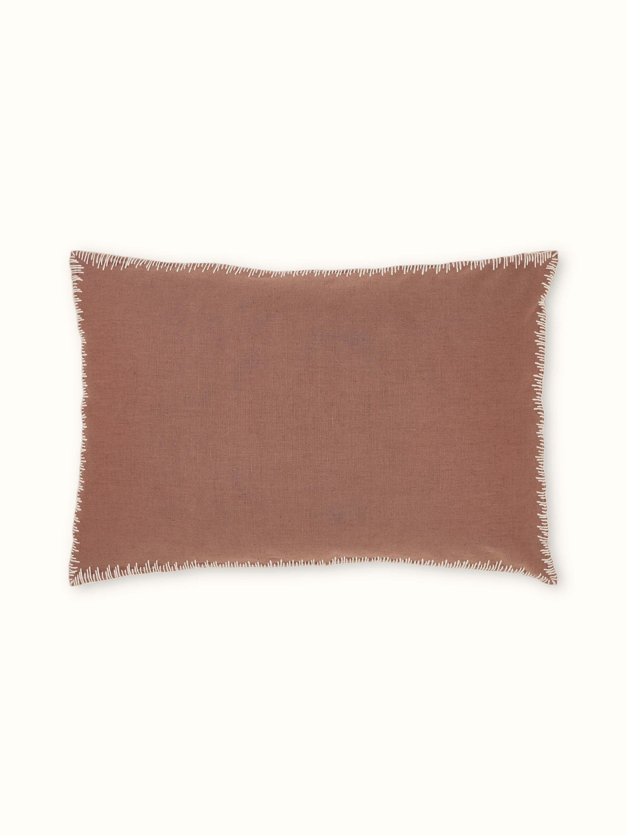 Front view of Parvat brown edge stitch linen cotton cushion cover featuring edge stitch embroidery