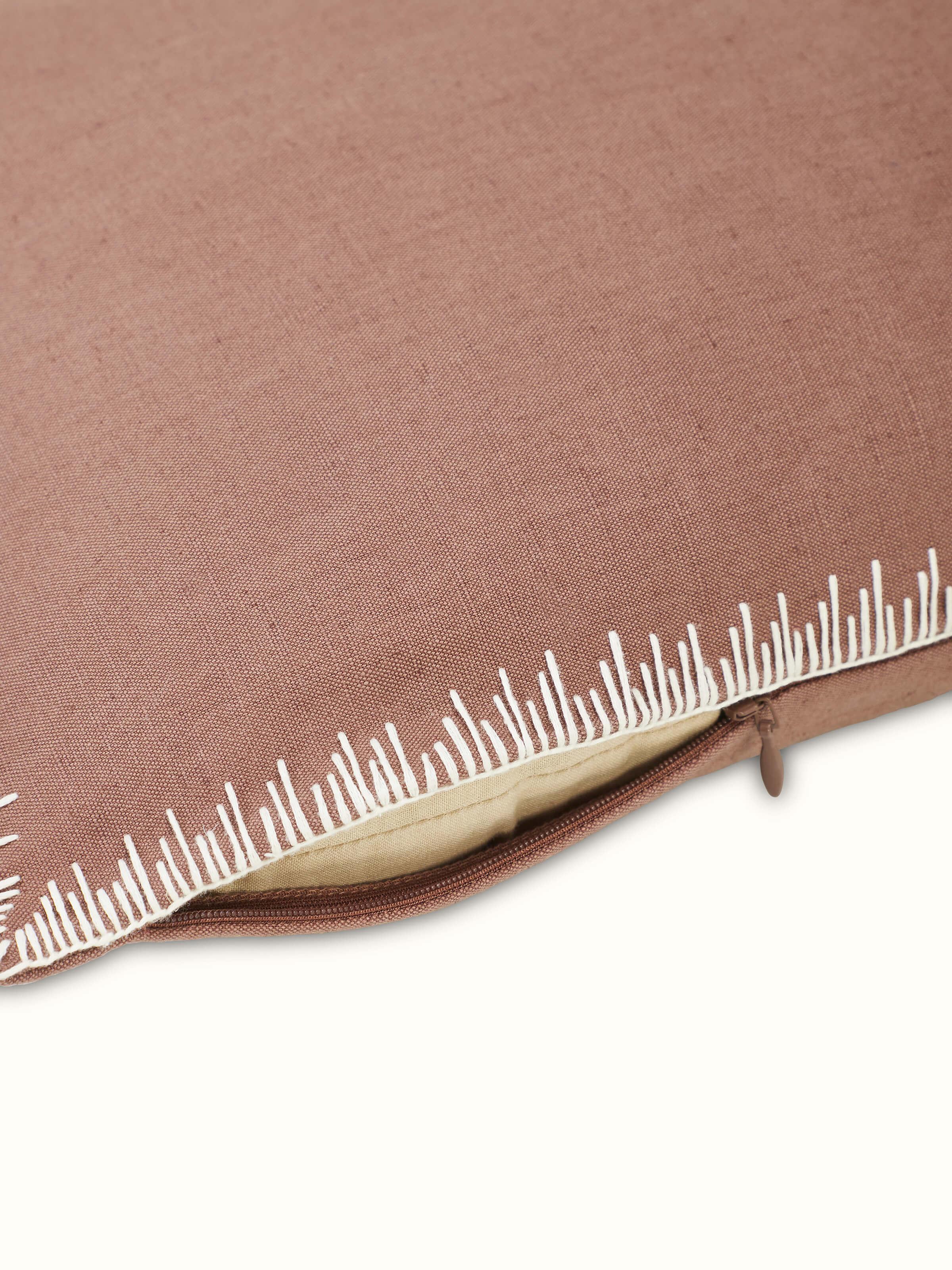 Detailed view of Parvat brown edge stitch linen cotton cushion cover highlighting embroidery and fabric texture