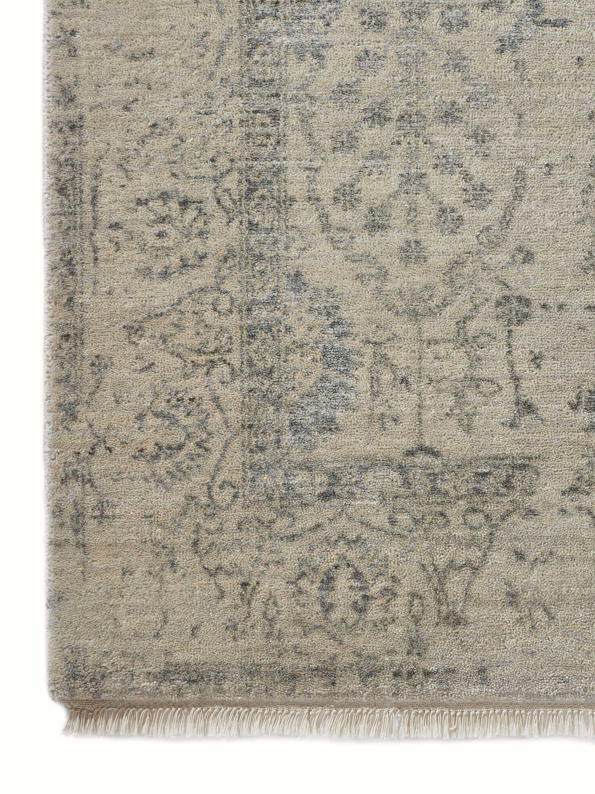 Full view of the distressed transitional Agra carpet highlighting its charcoal tones and intricate hand-knotted details