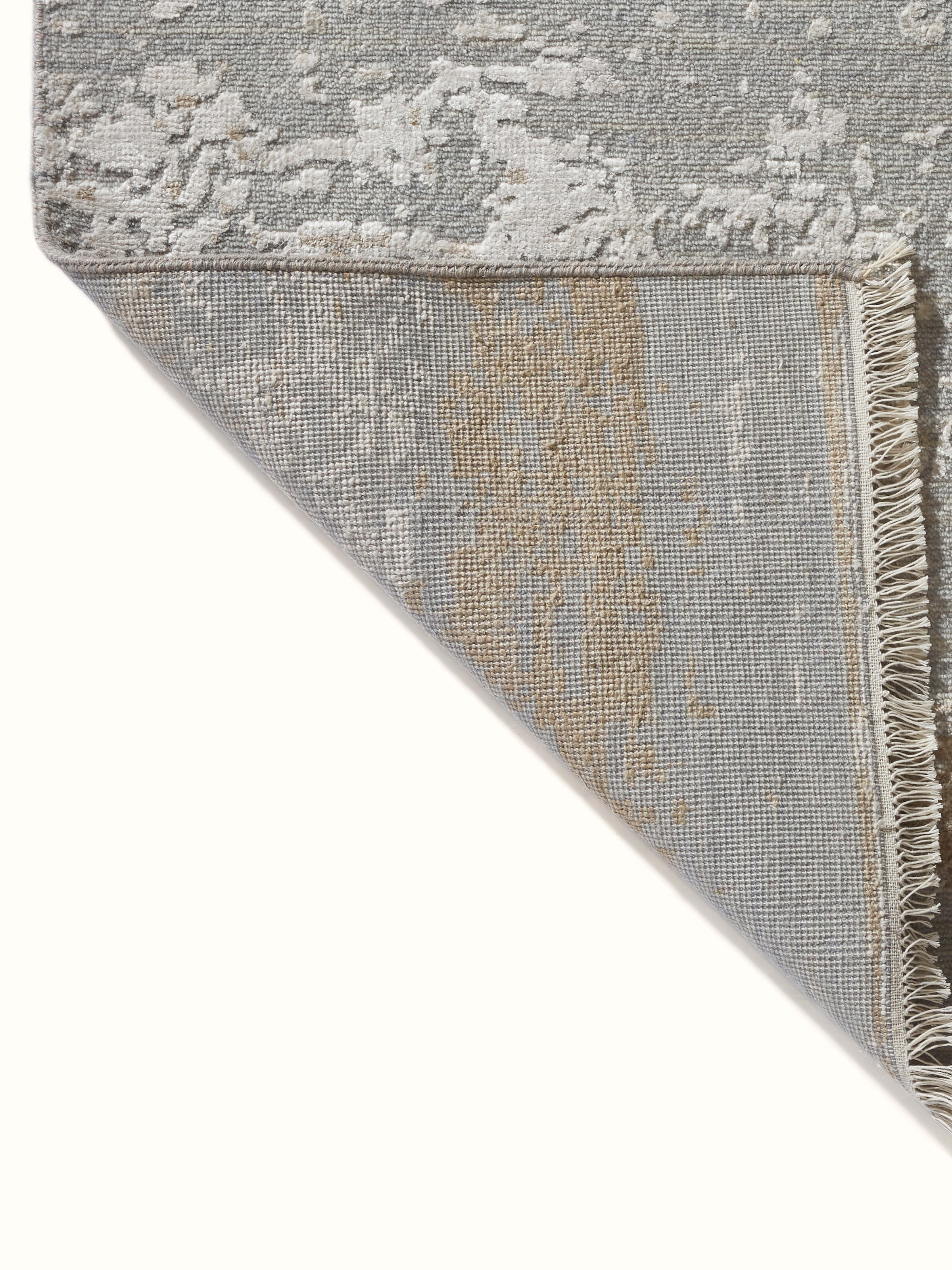 Back view of abstract grey taupe Agra rug showing fine hand-knotting technique