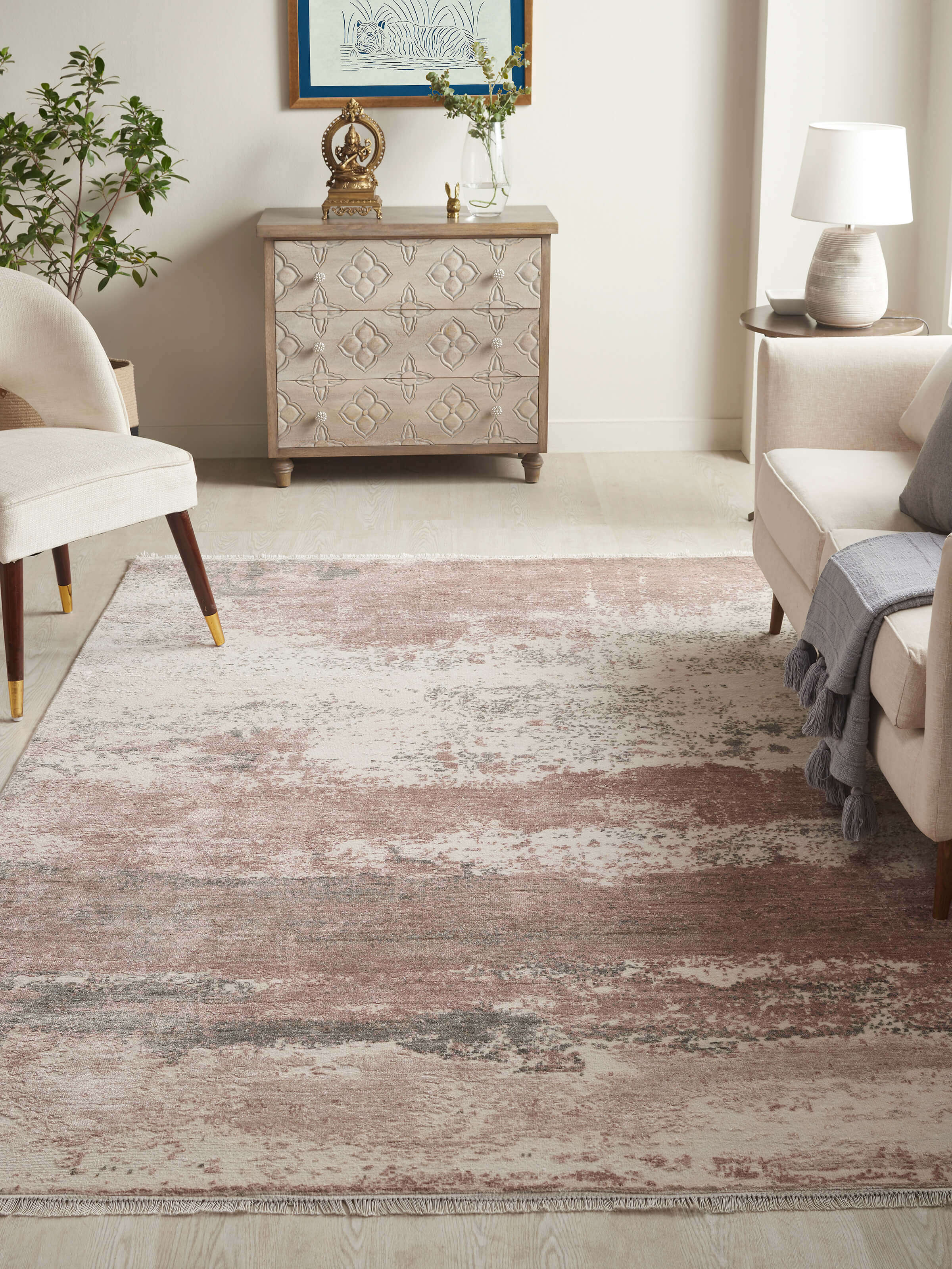 Lifestyle setting with peach and grey abstract Agra carpet enhancing contemporary decor.