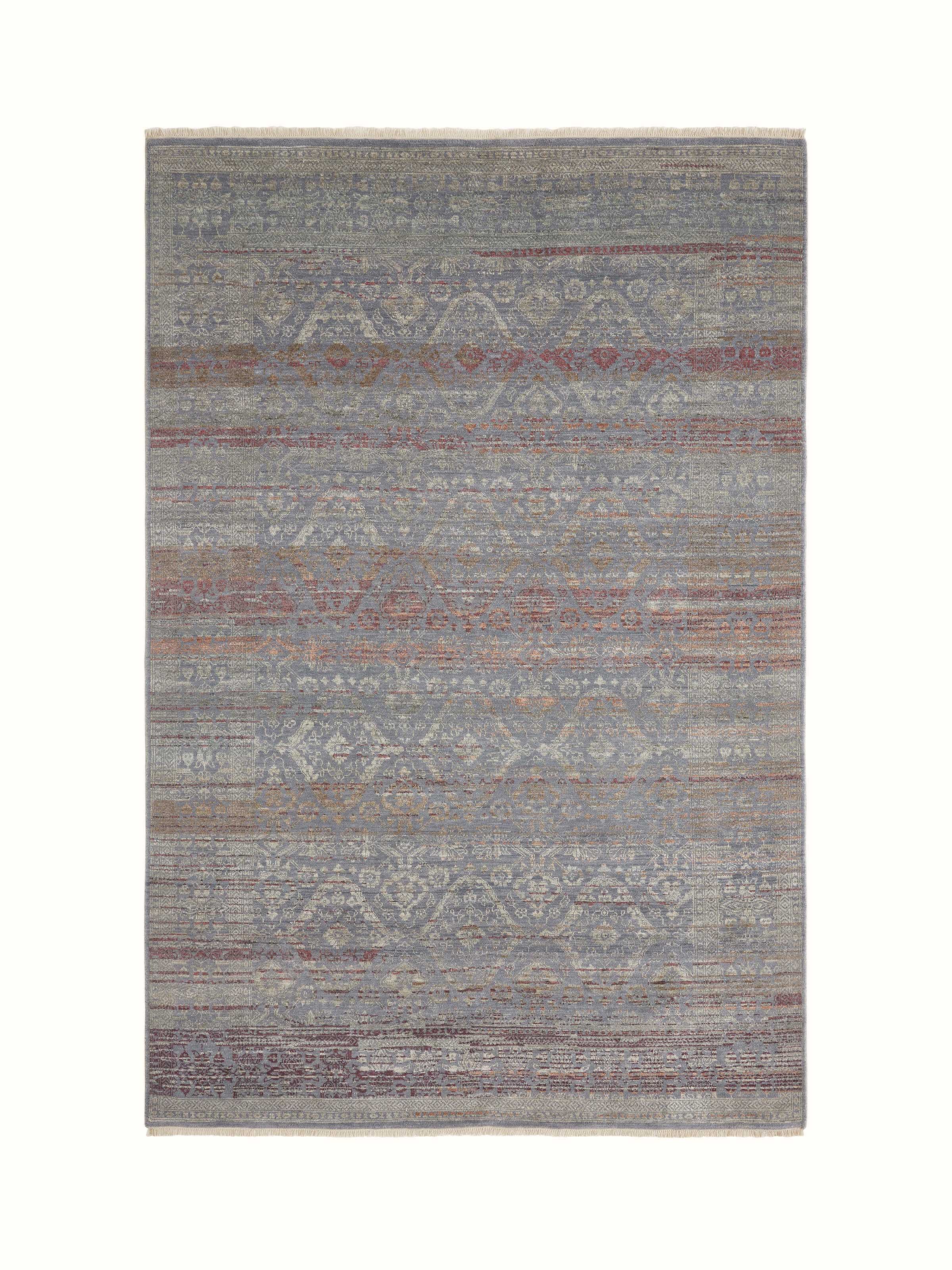 Full front view showcasing distressed grey-purple hand-knotted Agra carpet.