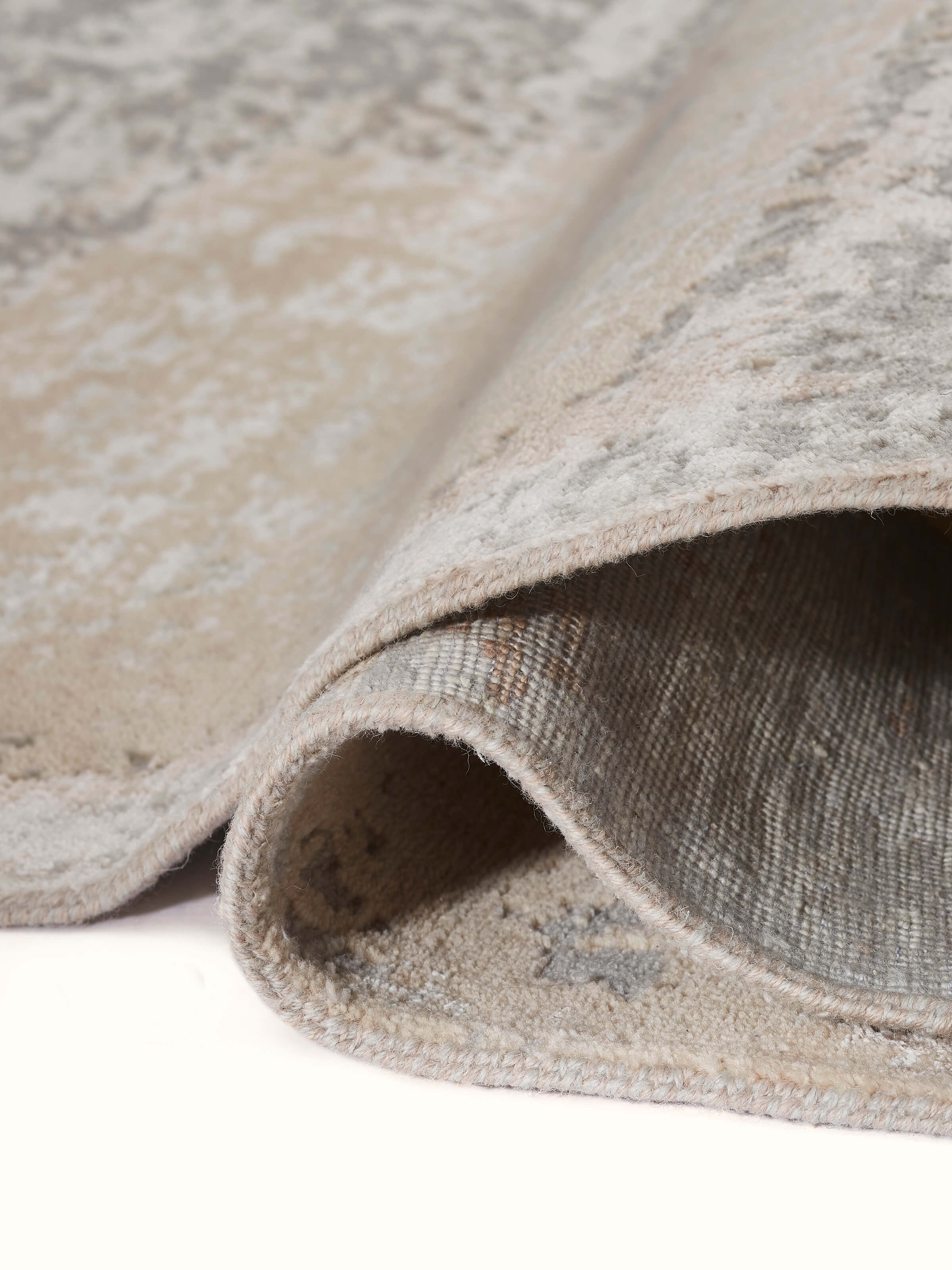 Detailed image of Modern Abstract Grey Beige Agra Wool & Viscose Hand-Knotted Carpet, focusing on the rich textures and patterns.