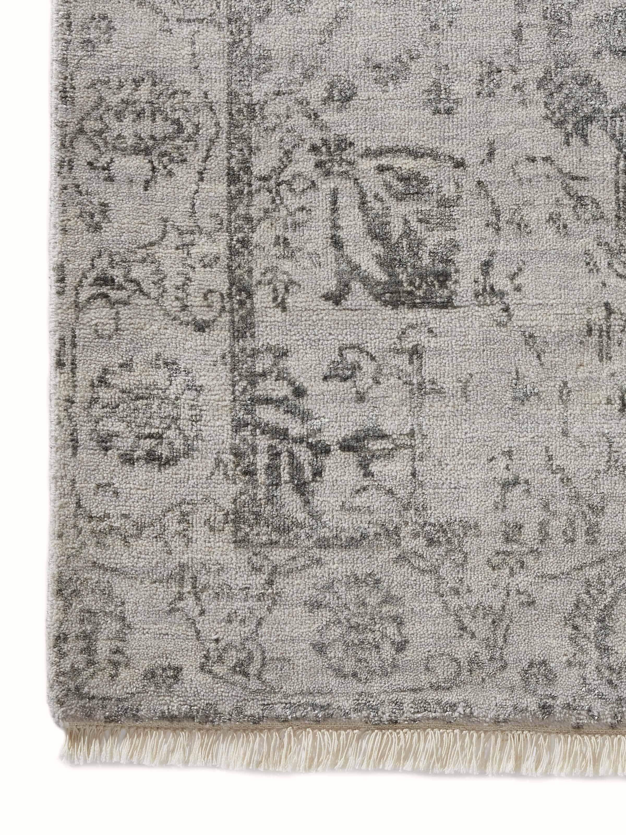 Distressed transitional grey charcoal Agra wool & viscose hand-knotted runner with focus on intricate pattern.