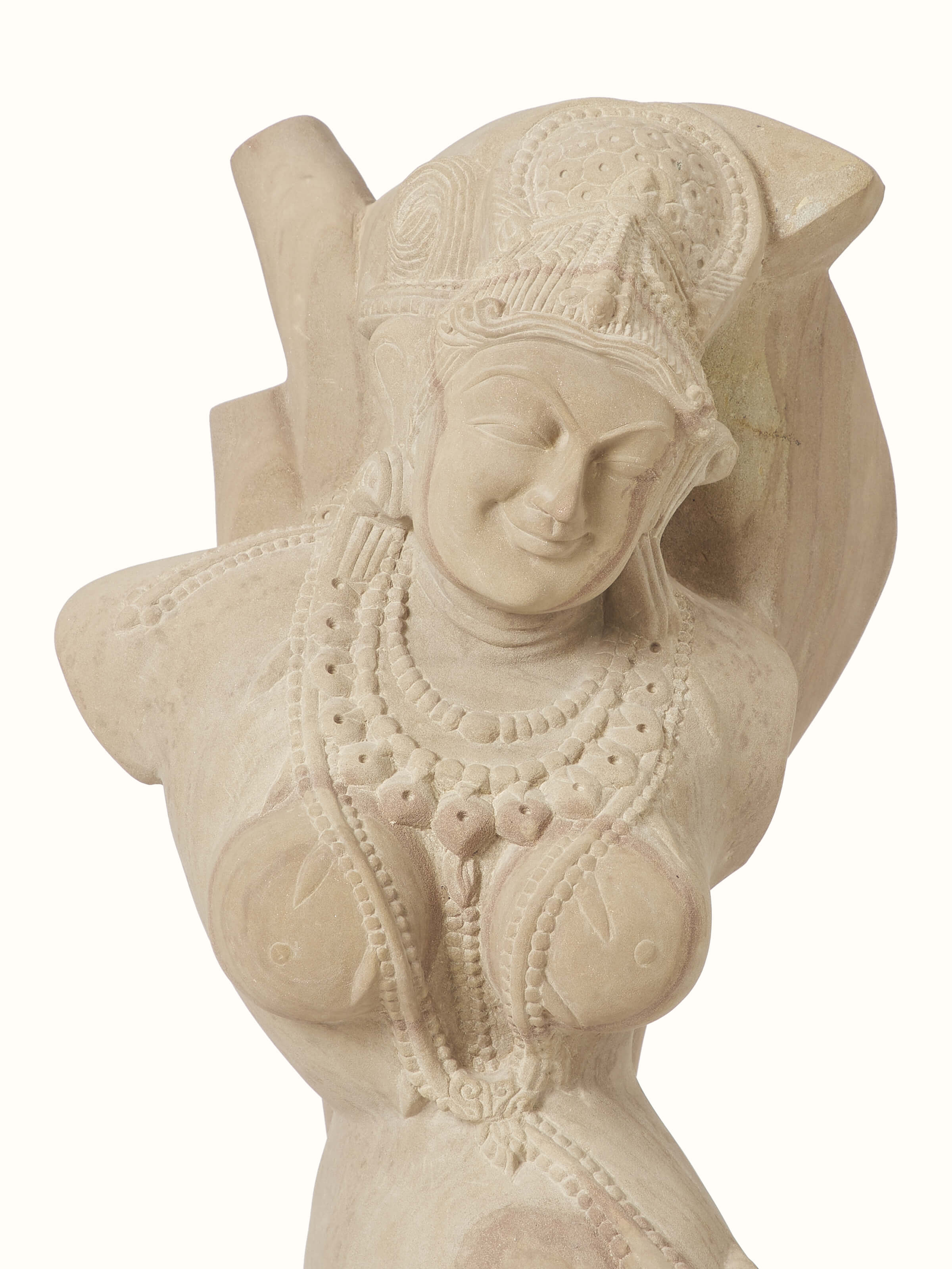 Close-up of Gorgeous Gwalior carved stone apsara sculpture, emphasizing intricate details and craftsmanship.