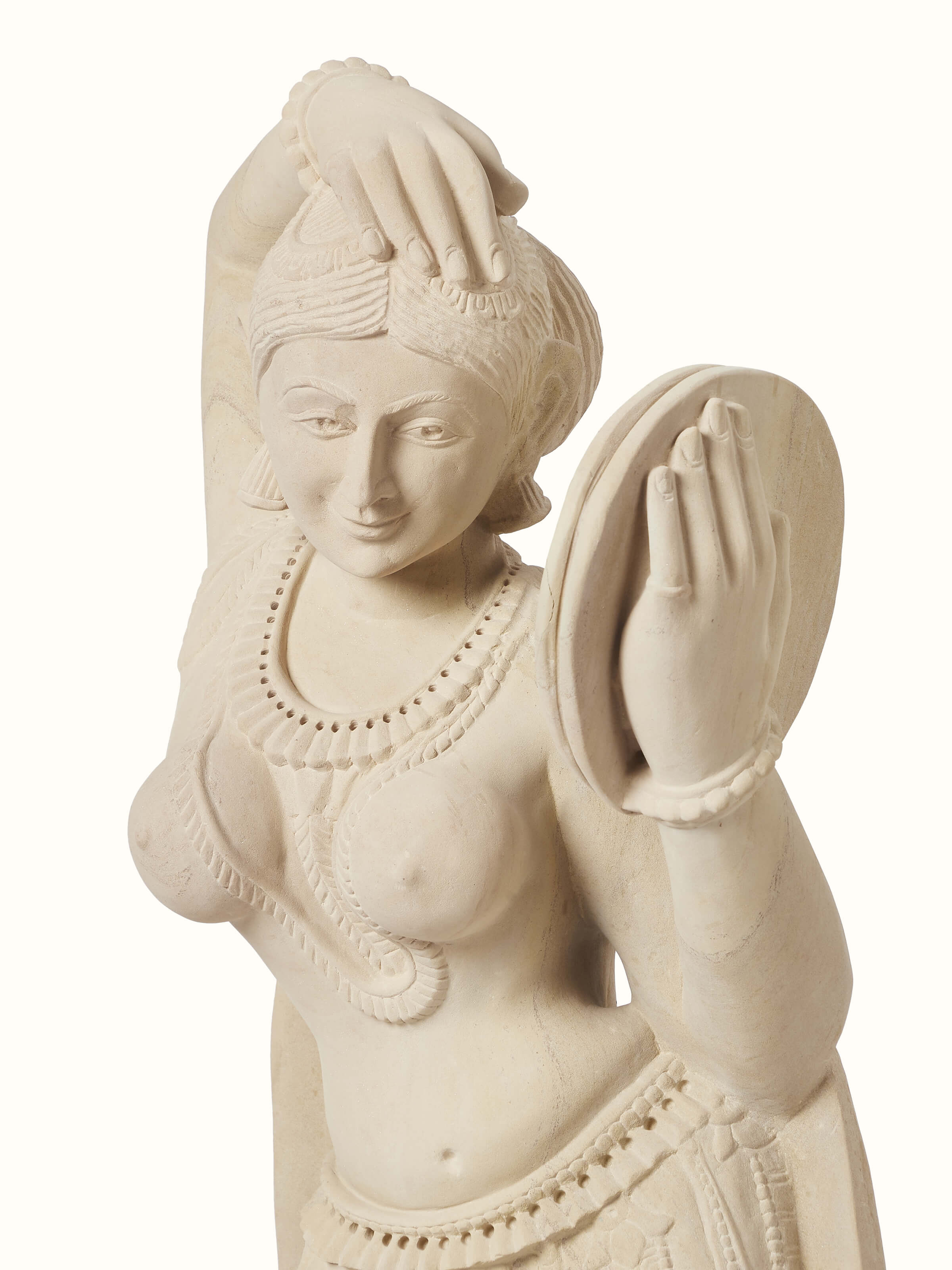 Detailed close-up of the Gwalior carved stone Apsara sculpture with a mirror.