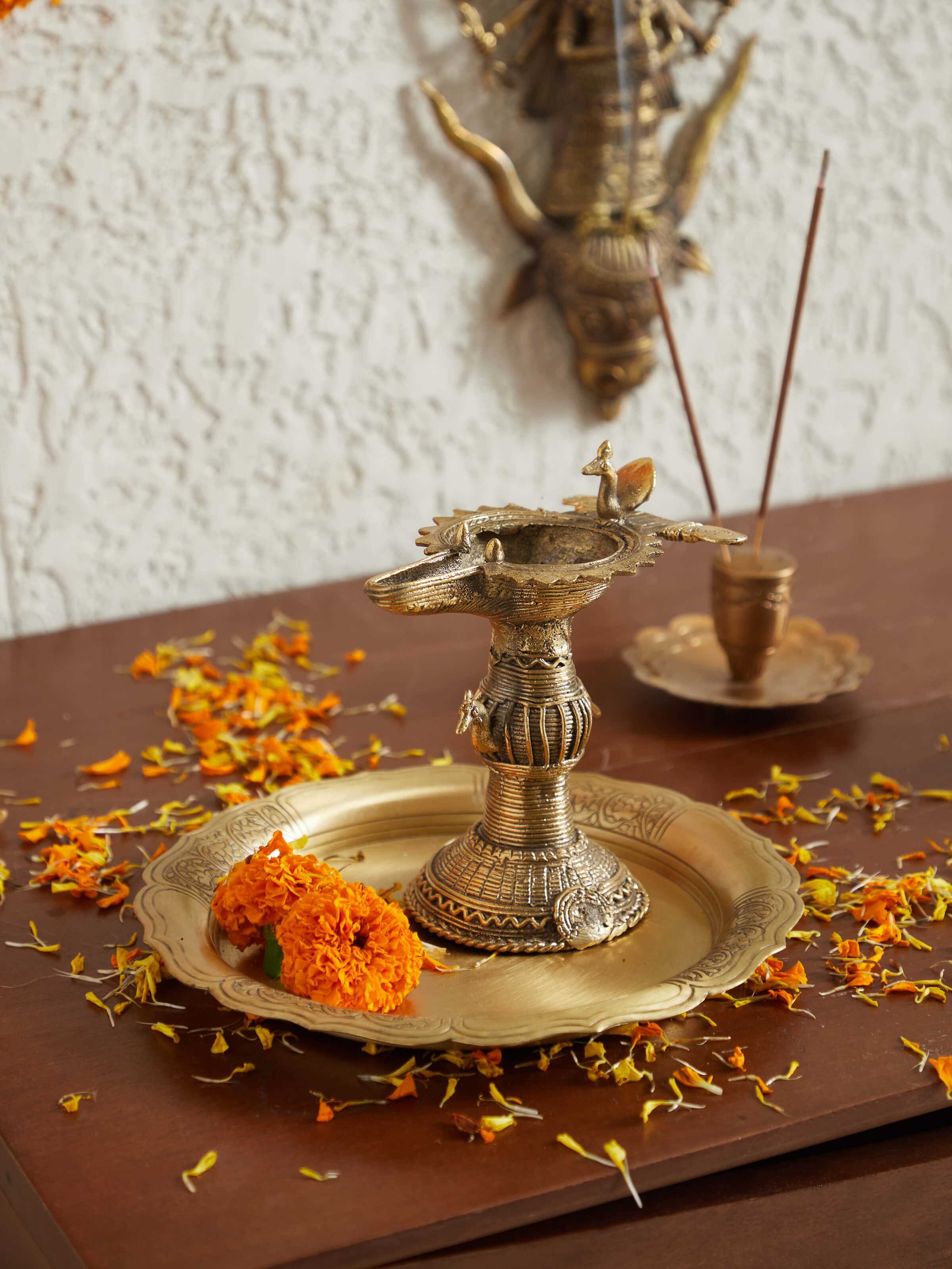 Side view of Antique brass dhokra diya showing its intricate brasswork and classic appeal