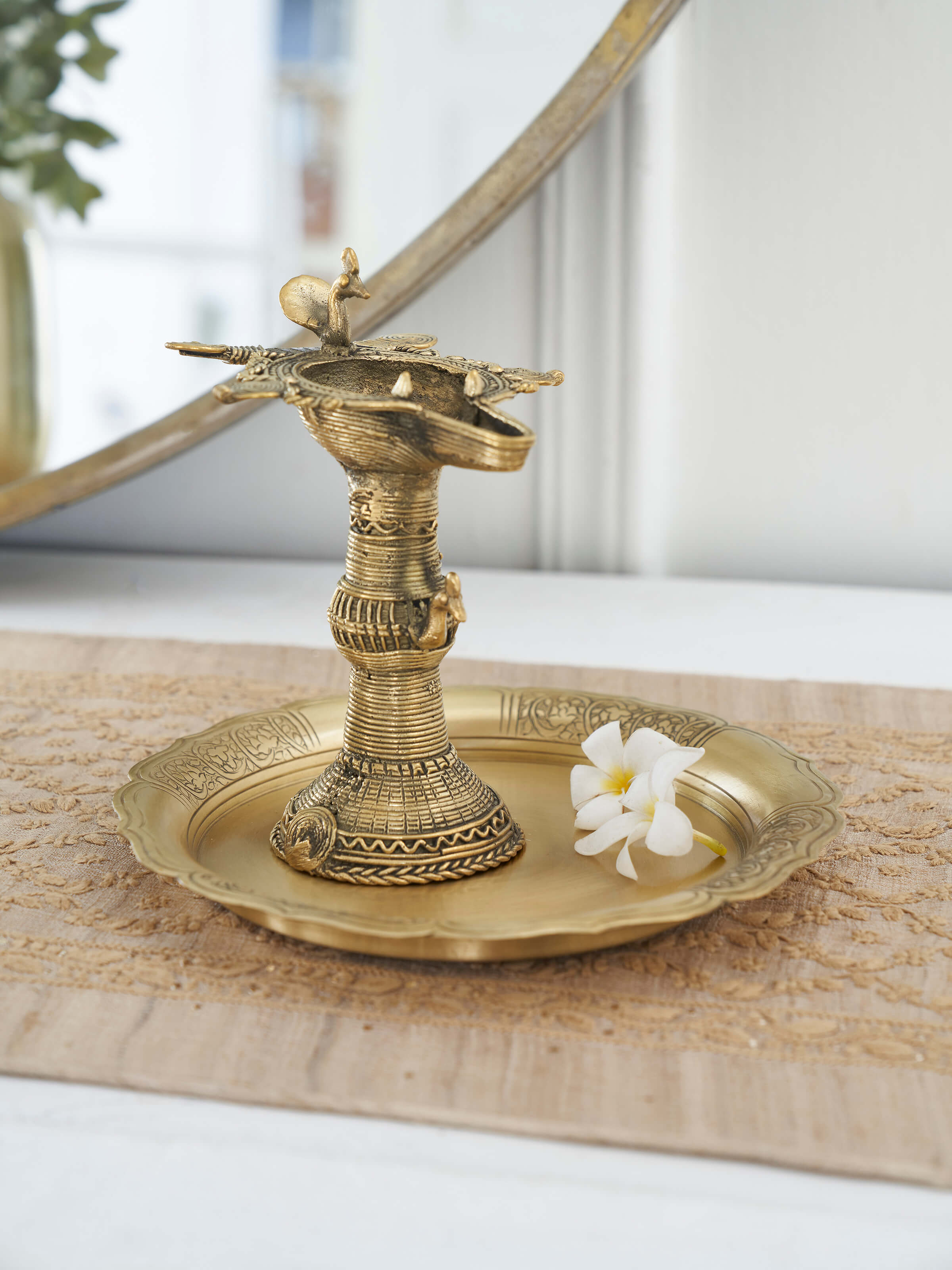 Side view of Traditional Antique Brass Dhokra Diya highlighting its detailed design and finish