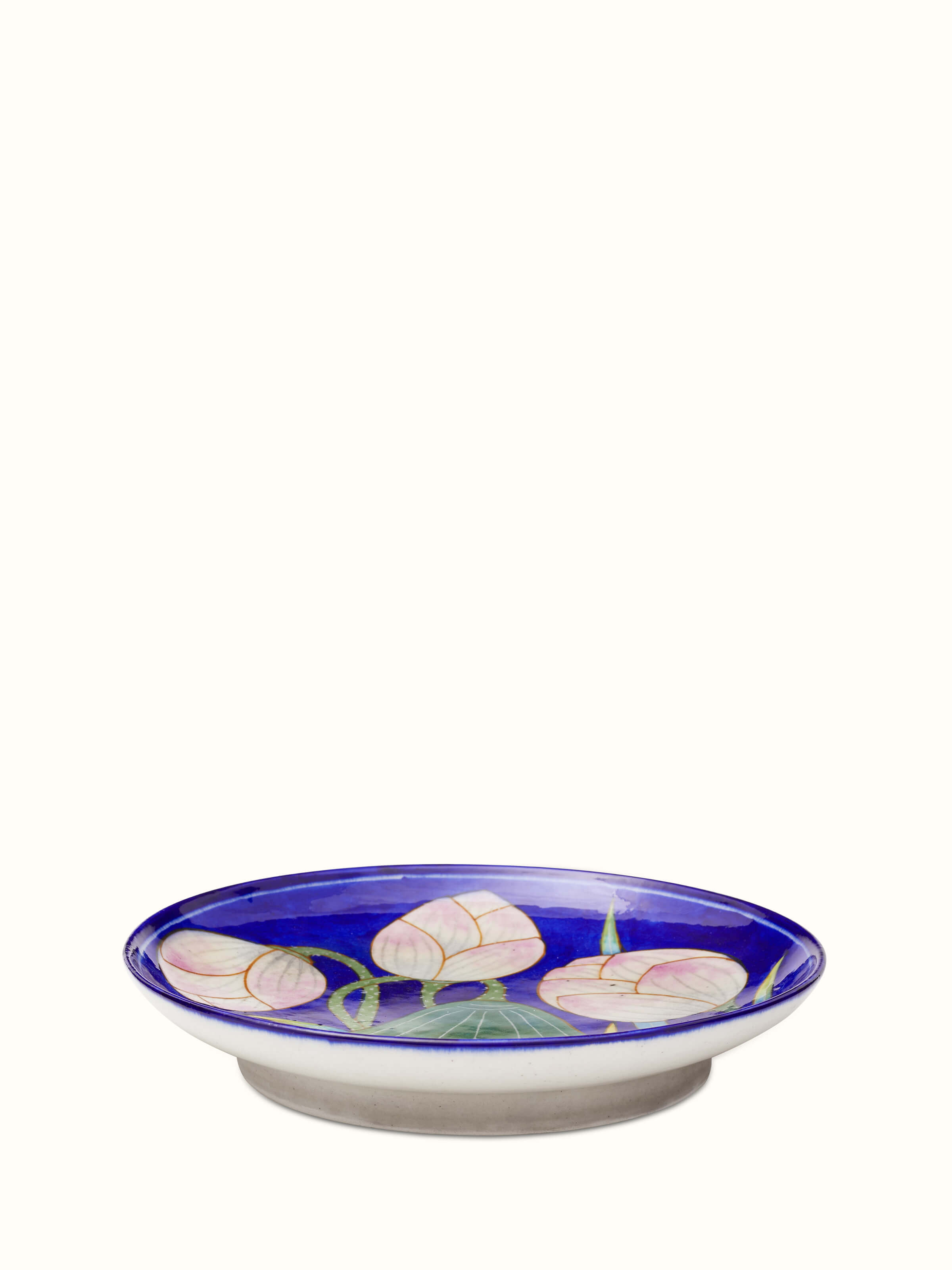 Side view of Blue Pottery Lotus with Leaf Display Plate by Swadesh emphasizing the graceful lotus design and vibrant blue colors.