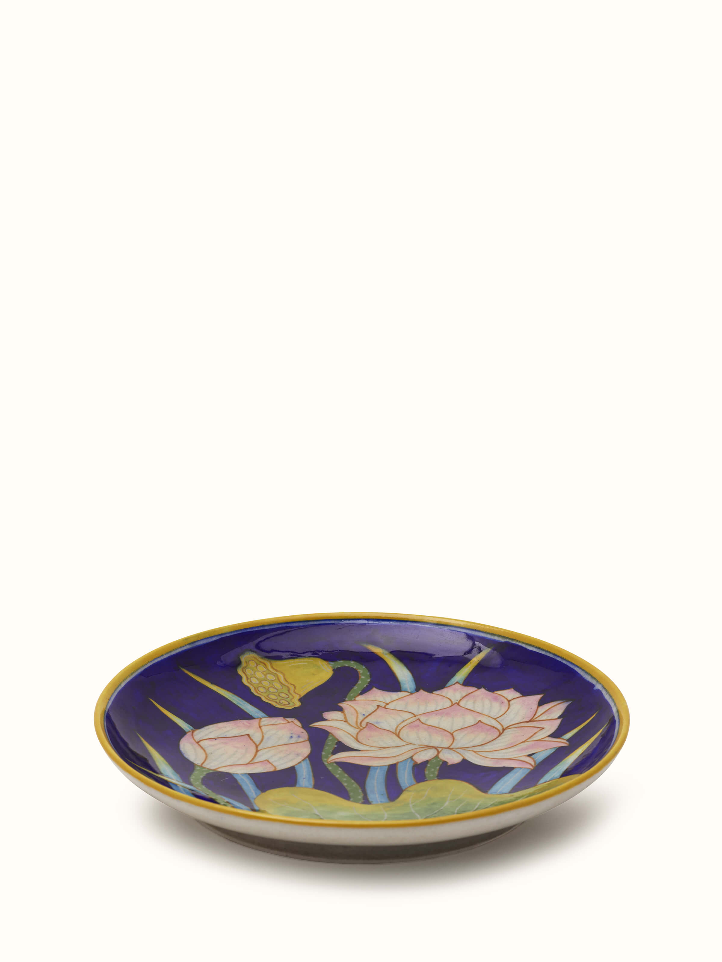 Side view of Blue Pottery flower with leaf display plate highlighting its intricate pattern and vibrant colors