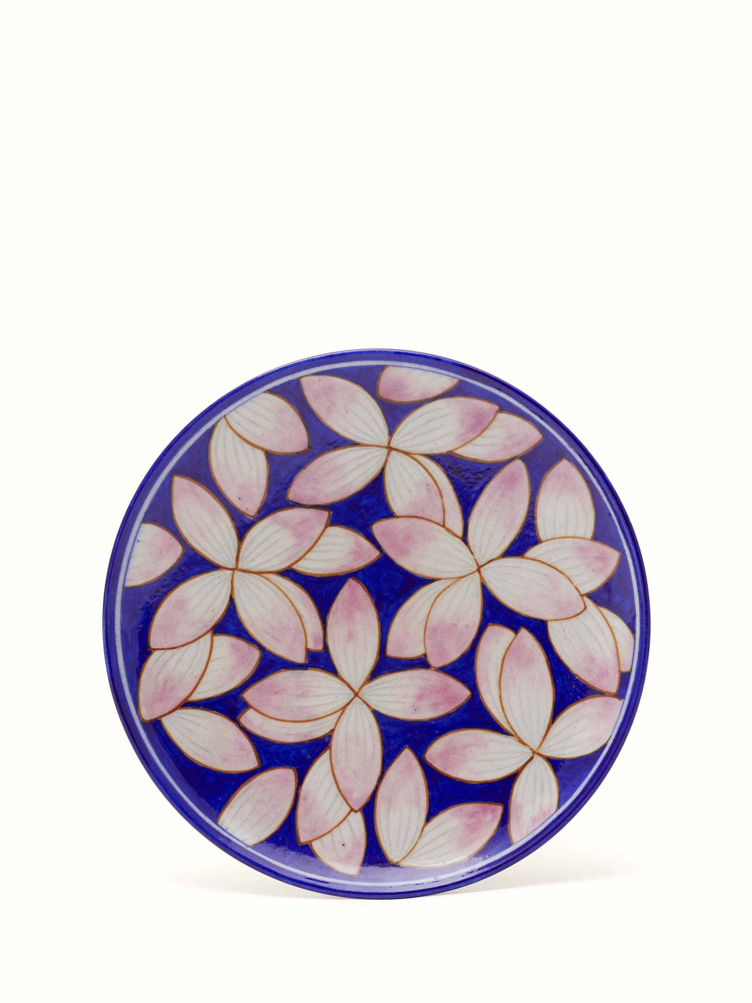 Blue pottery petals display plate with floral patterns and intricate detailing.