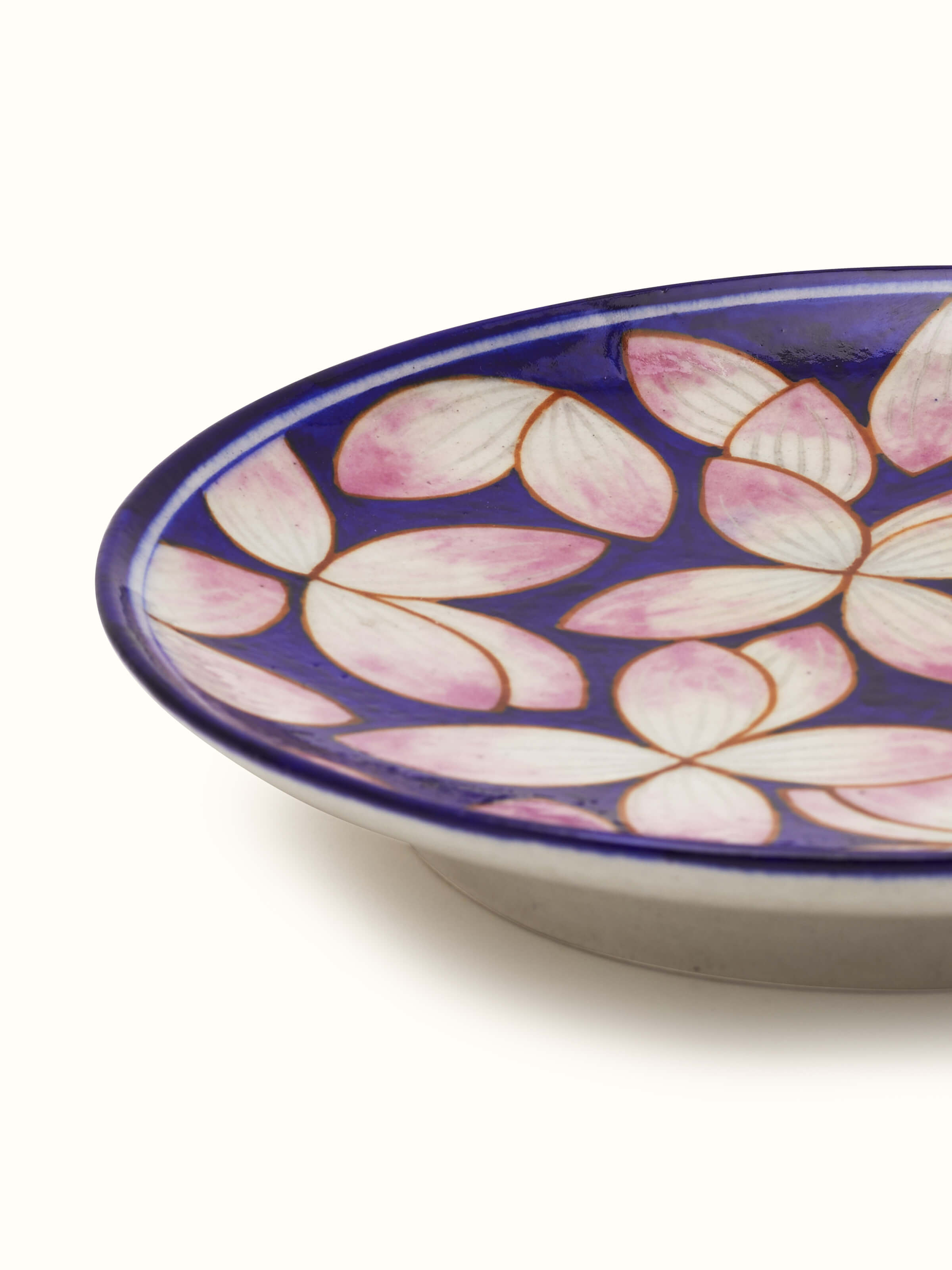 Blue pottery petals display plate with intricate floral design and fine craftsmanship.