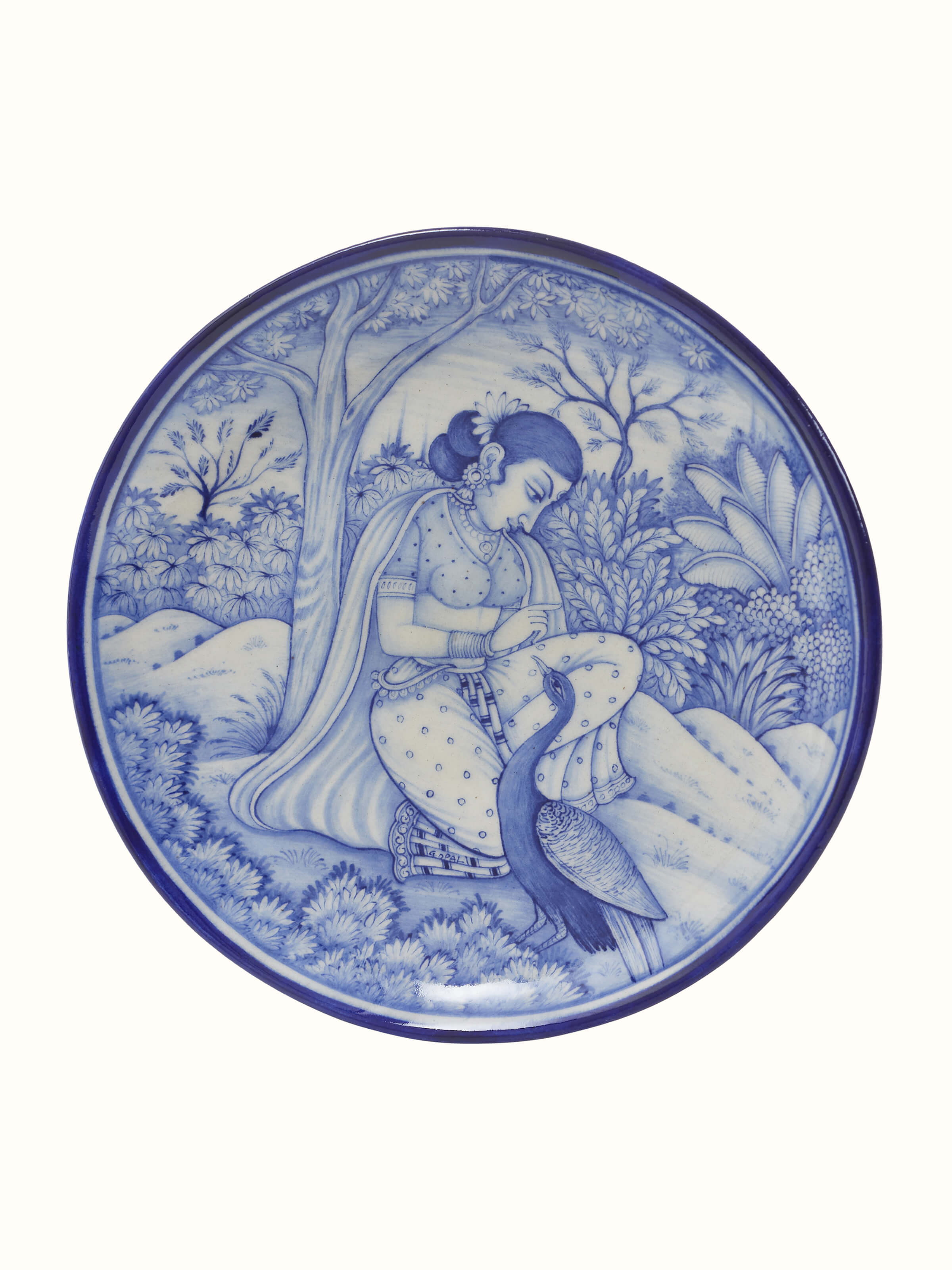 Front view of Blue Pottery Woman under Tree Display Plate by Swadesh showcasing intricate artwork and vibrant blue hues.