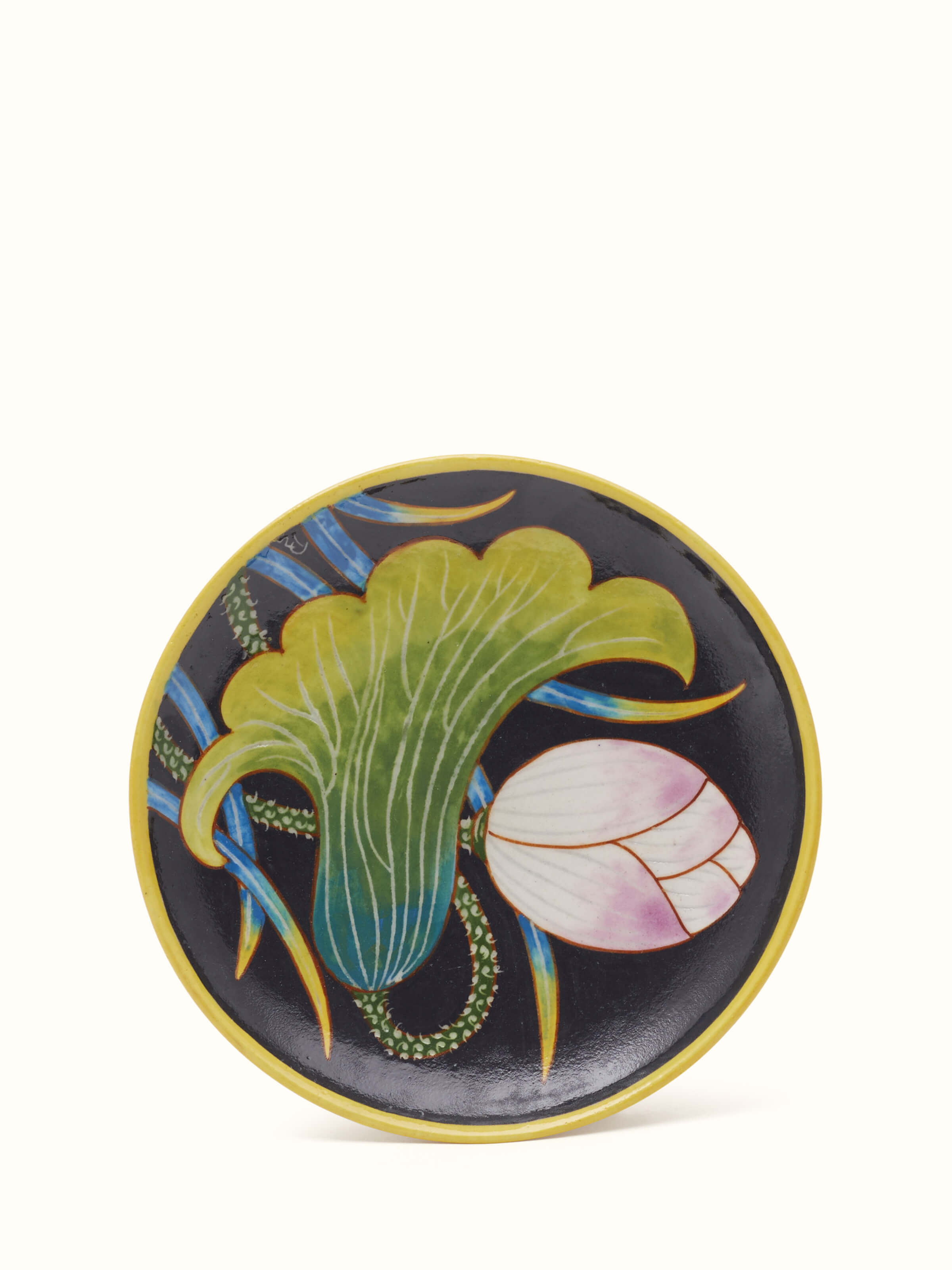 Front view of Blue pottery black flower display plate highlighting the intricate flower design and vibrant blue color