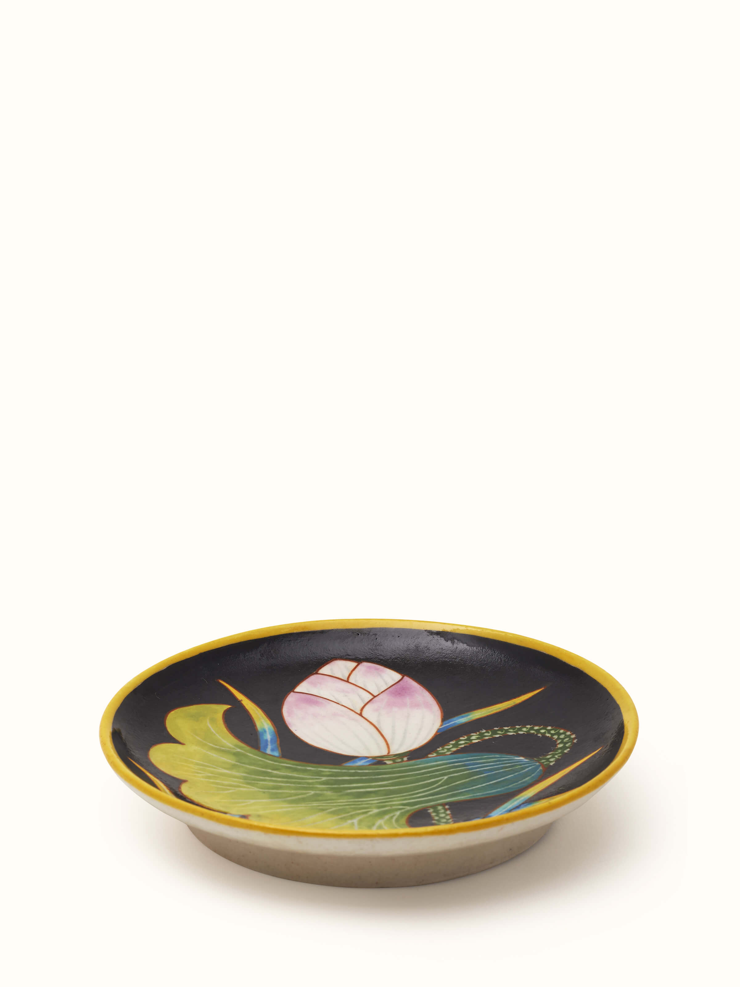 Side view of Blue pottery black flower display plate showcasing the detailed flower patterns and elegant design