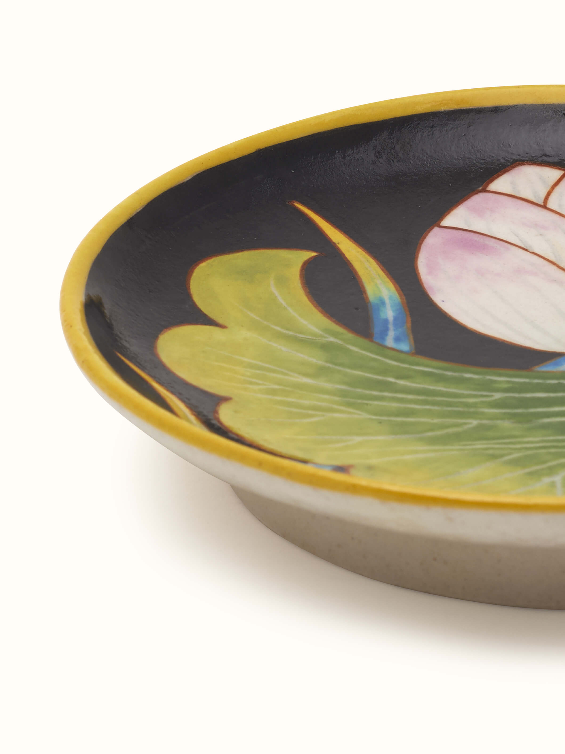 Detailed view of Blue pottery black flower display plate focusing on the elegant design and rich blue color