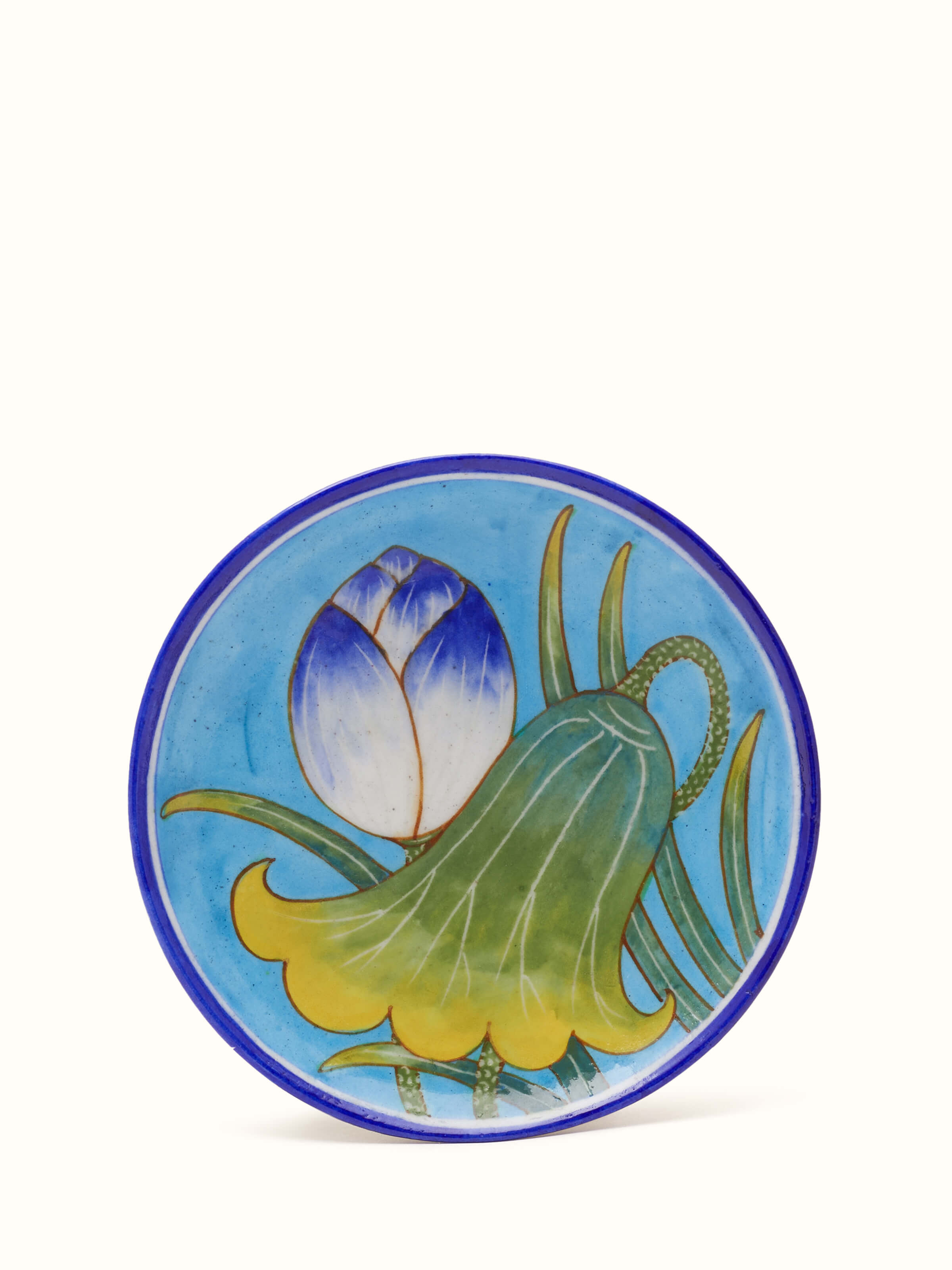 Blue pottery floral display plate, featuring a vibrant floral design and intricate blue detailing.