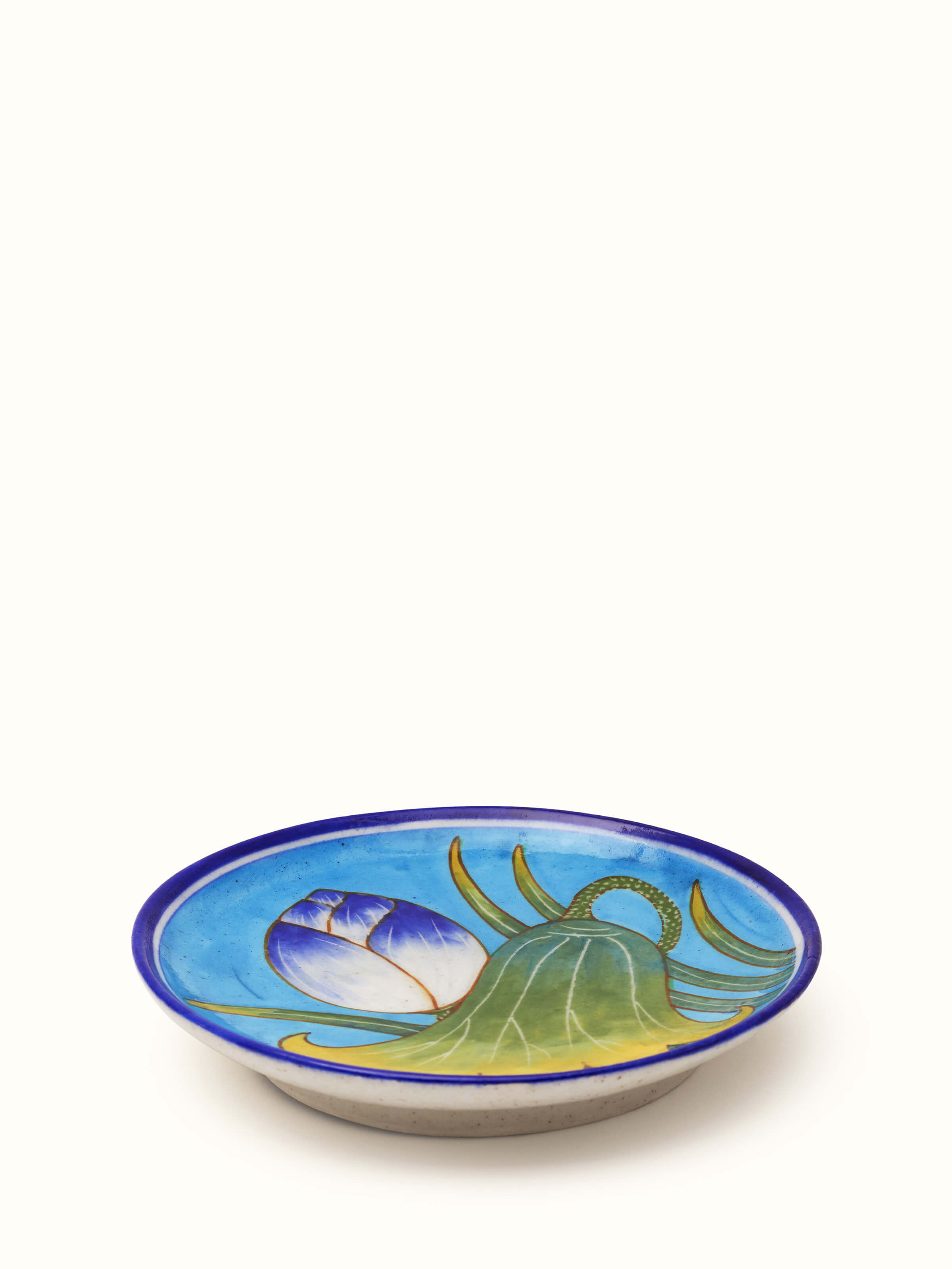 Close-up of blue pottery floral display plate, showcasing the rich blue patterns and elegant craftsmanship.