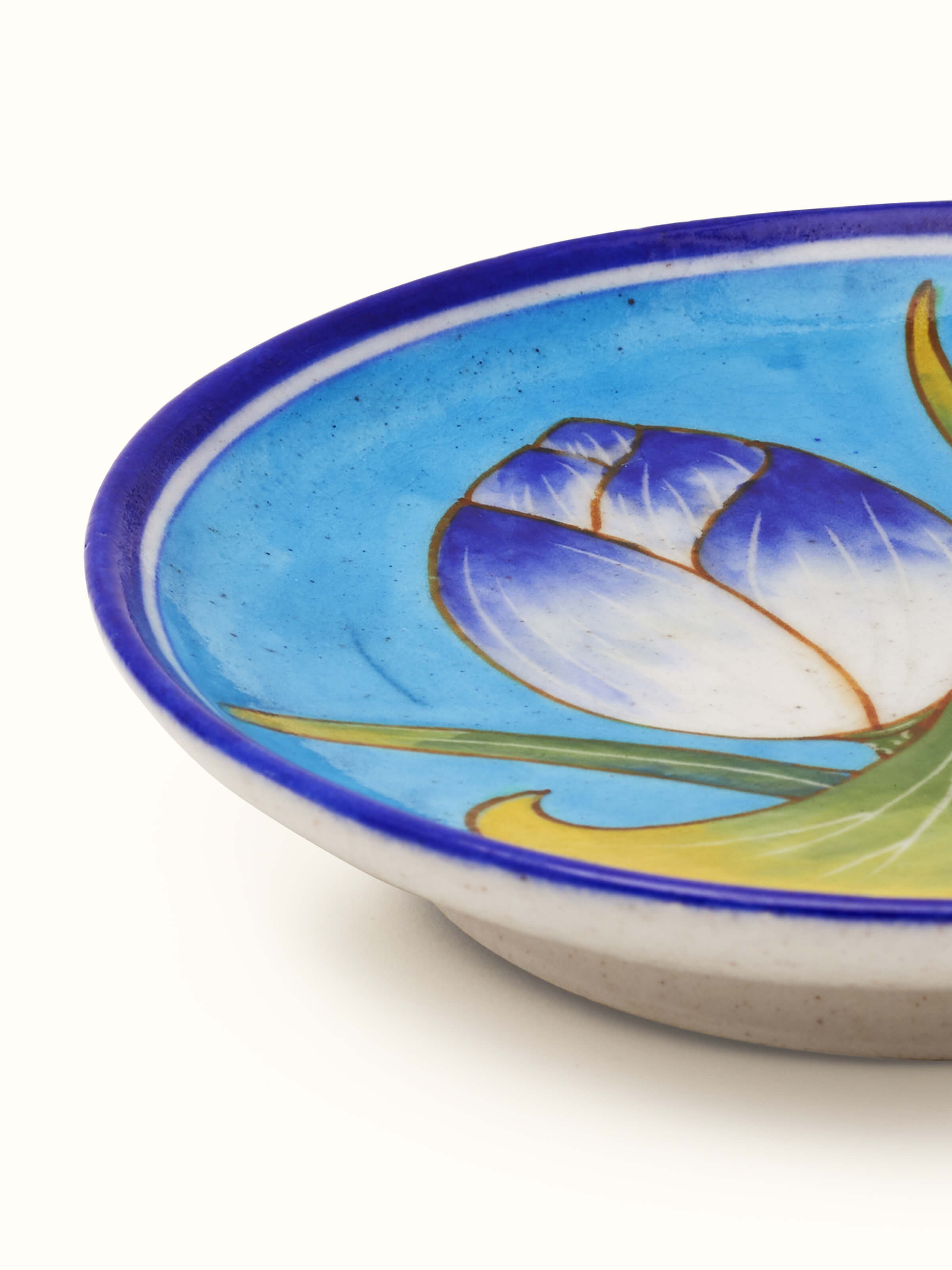 Full view of blue pottery floral display plate, emphasizing the vibrant blue floral design and elegant presentation.