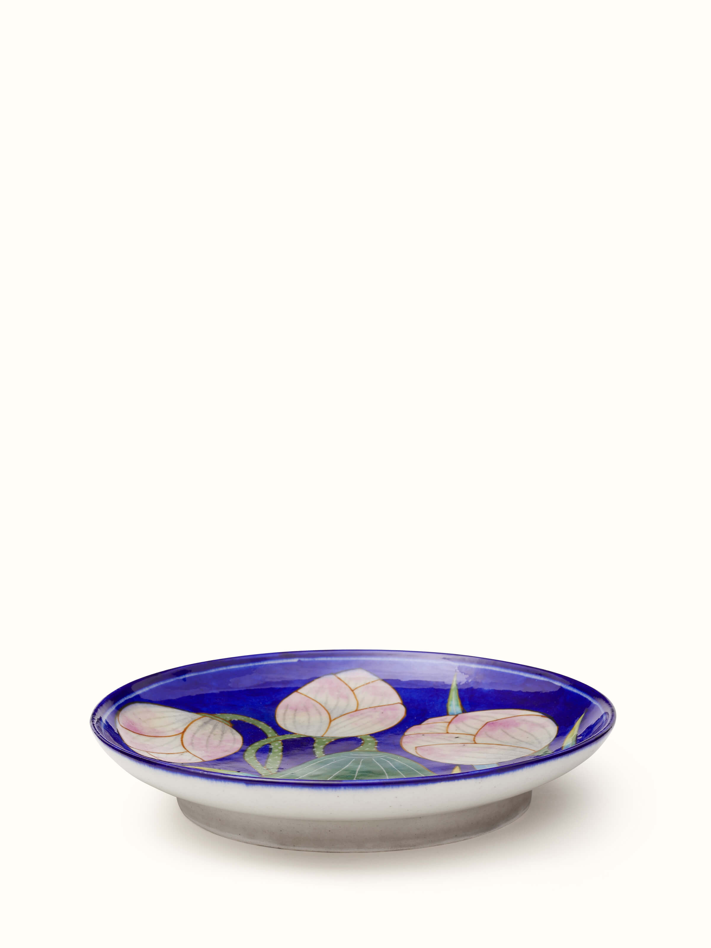 Front view of Blue Pottery Three Flowers Display Plate from Swadesh, displaying intricate blue floral patterns on smooth ceramic.