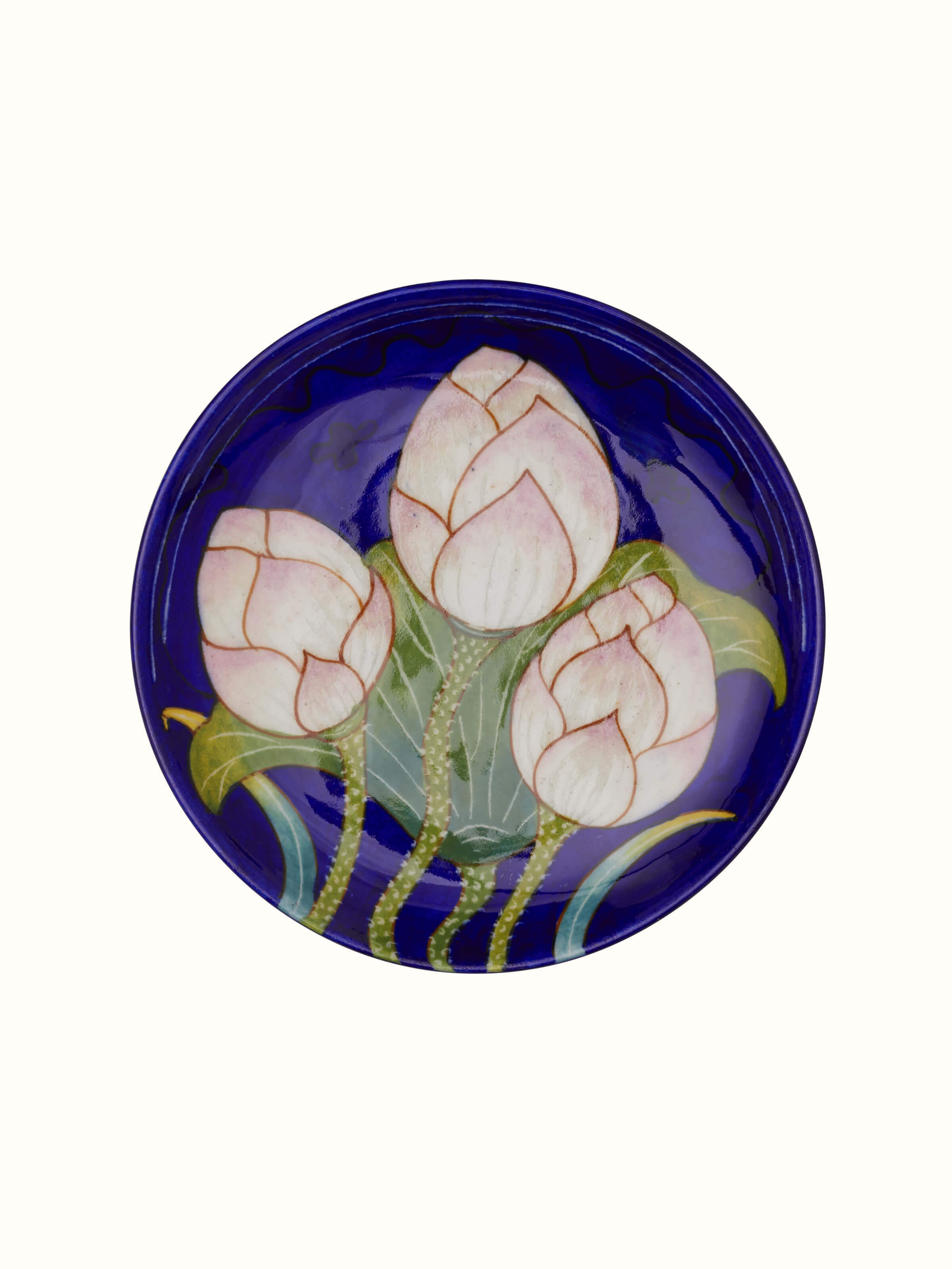 Detailed view of Blue Pottery Three Flowers Display Plate from Swadesh, emphasizing the fine ceramic finish and detailed floral artwork.