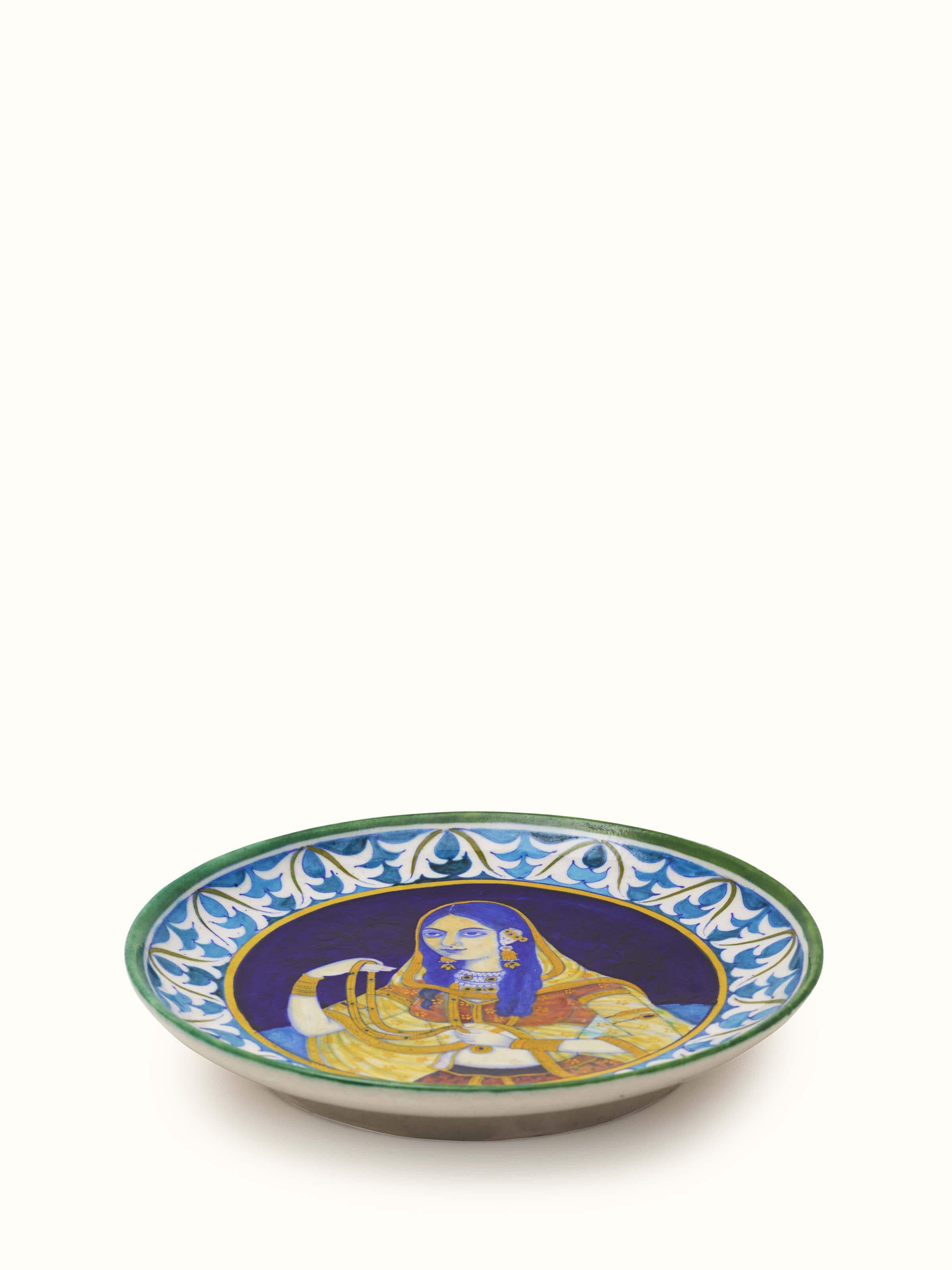 Side view of Blue Pottery Mughal Woman Display Plate featuring the detailed hand-painted design and vibrant colors