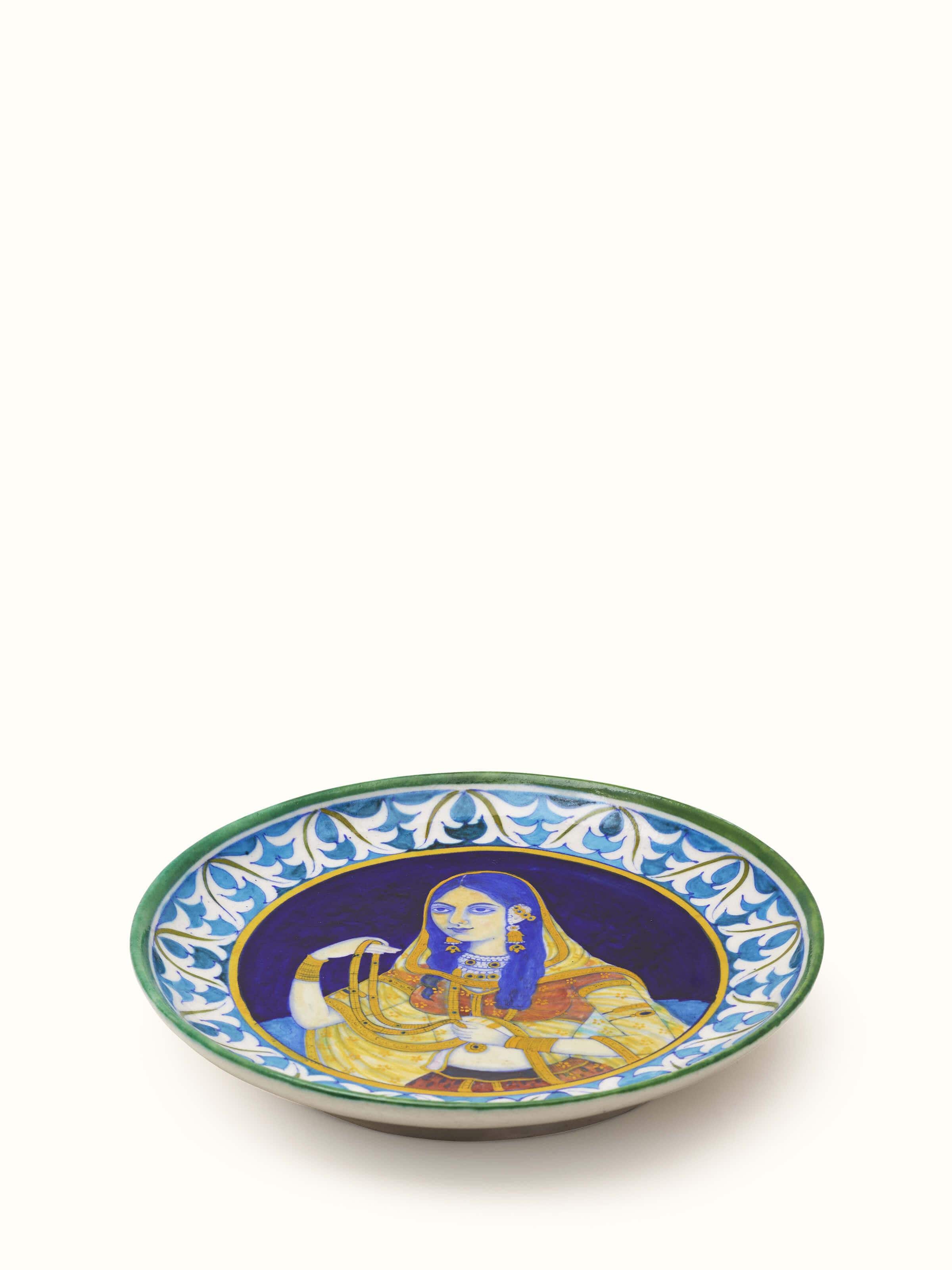 Angled view of Blue Pottery Mughal Woman Display Plate emphasizing the stunning hand-painted artistry