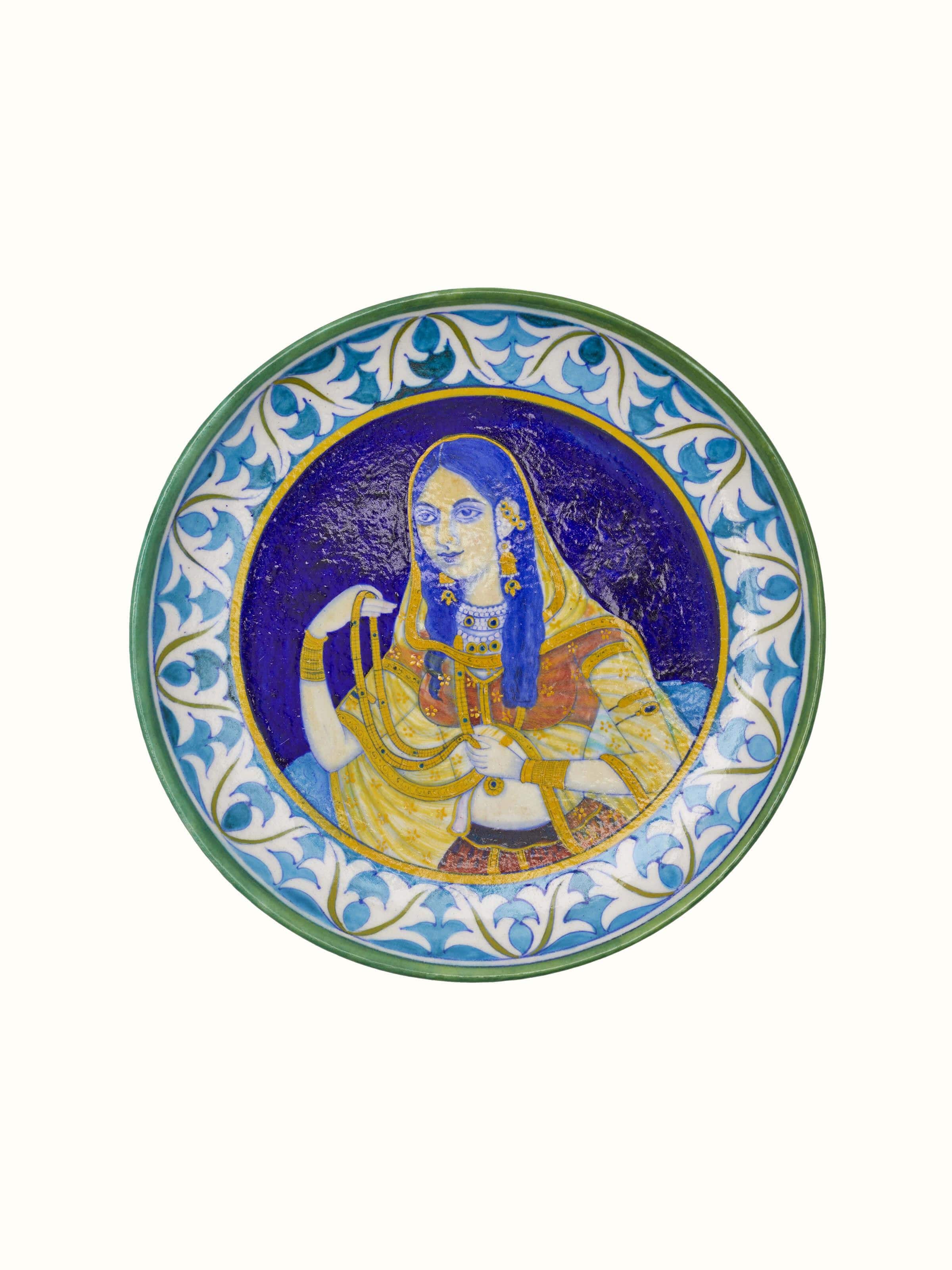 Close-up of Blue Pottery Mughal Woman Display Plate highlighting the intricate design and vivid blue pottery craftsmanship