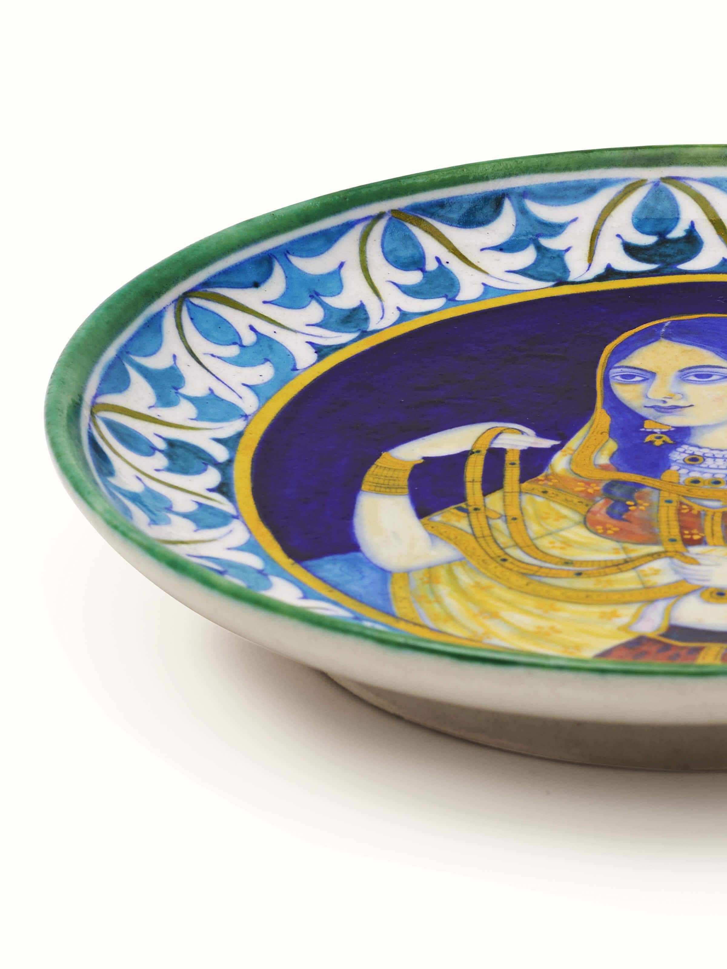 Detailed view of Blue Pottery Mughal Woman Display Plate showcasing the Mughal-inspired painting and high-quality pottery