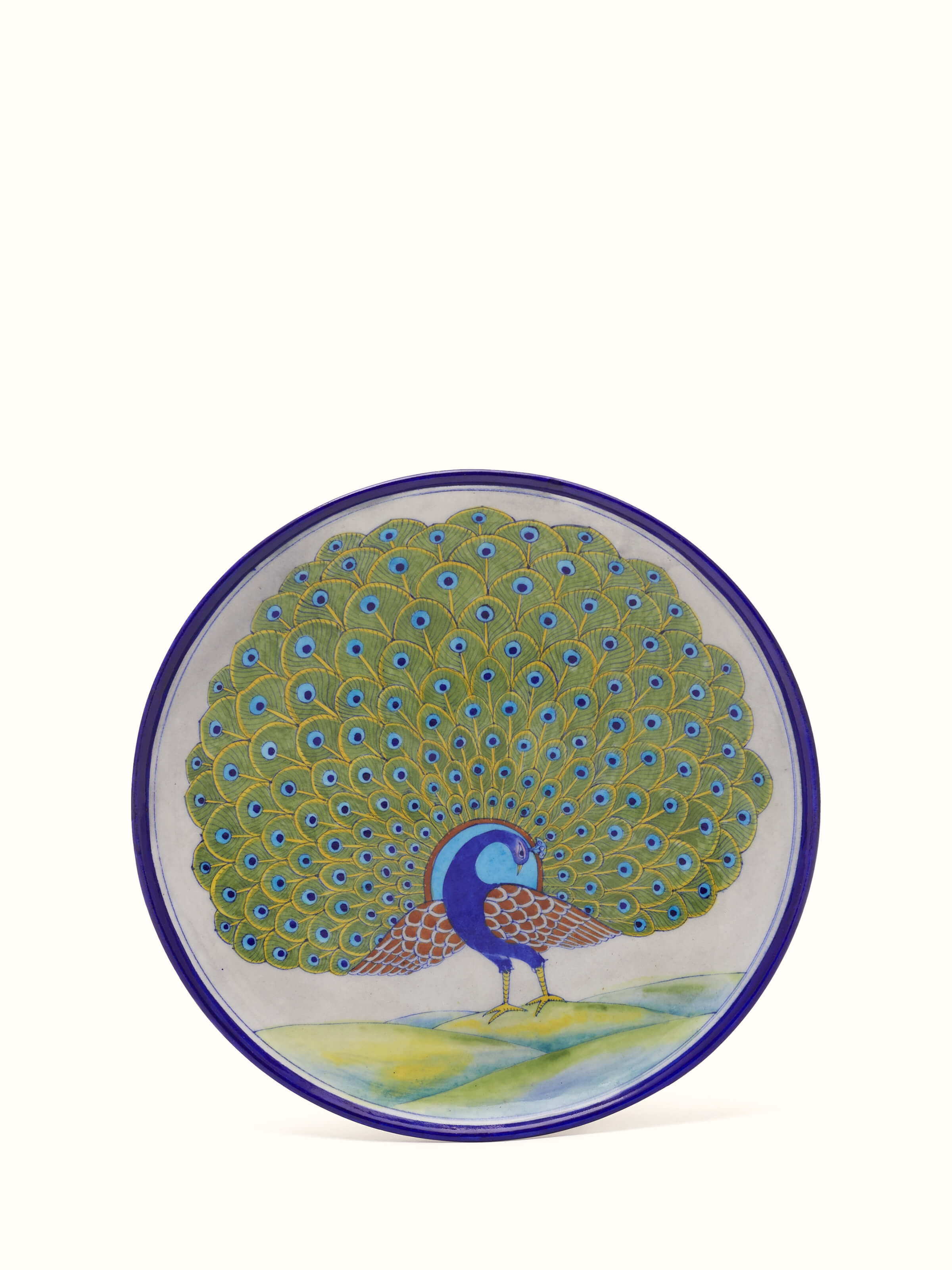 Front view of Blue pottery peacock display plate
