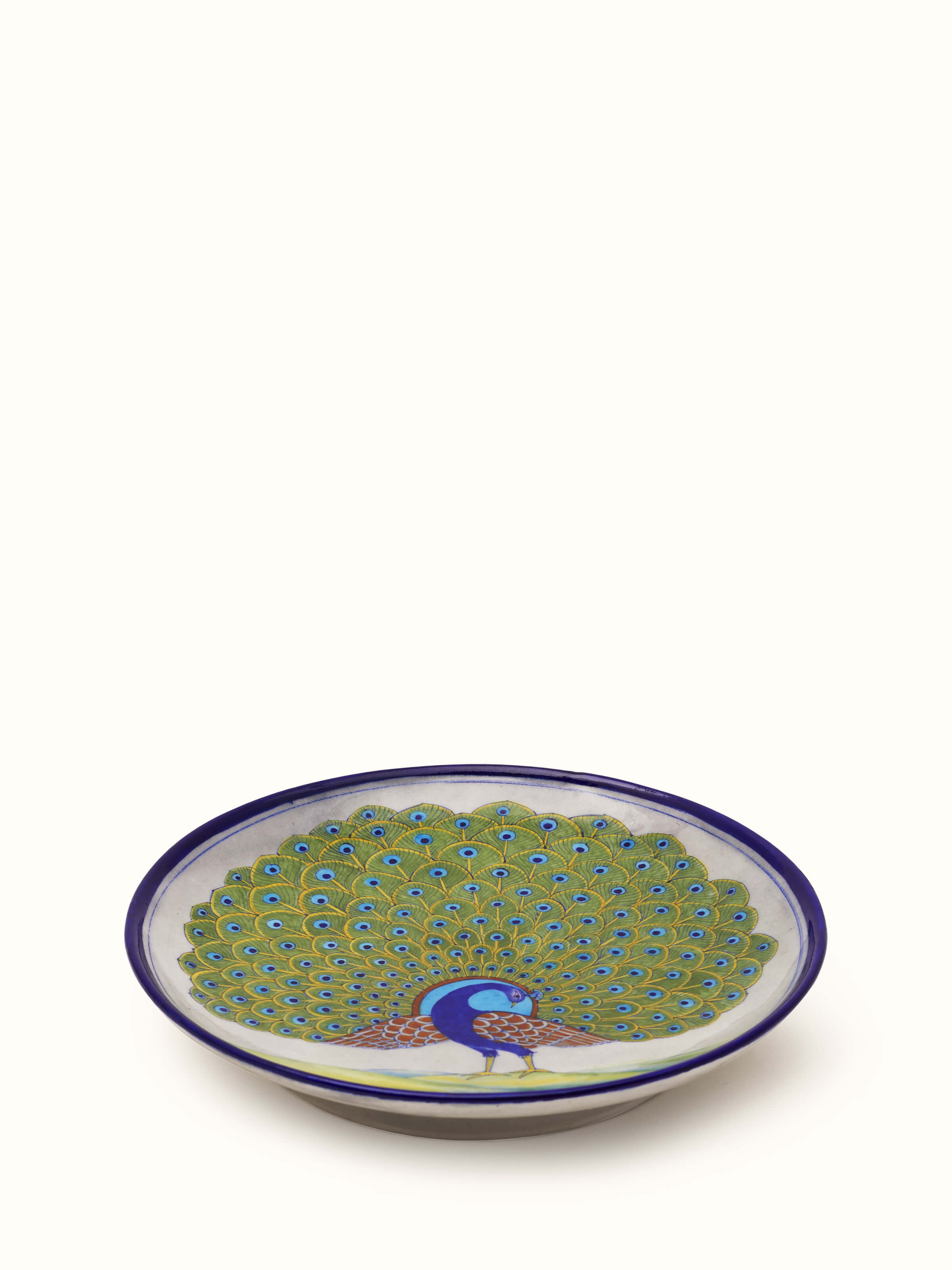 Side view of Blue pottery peacock display plate