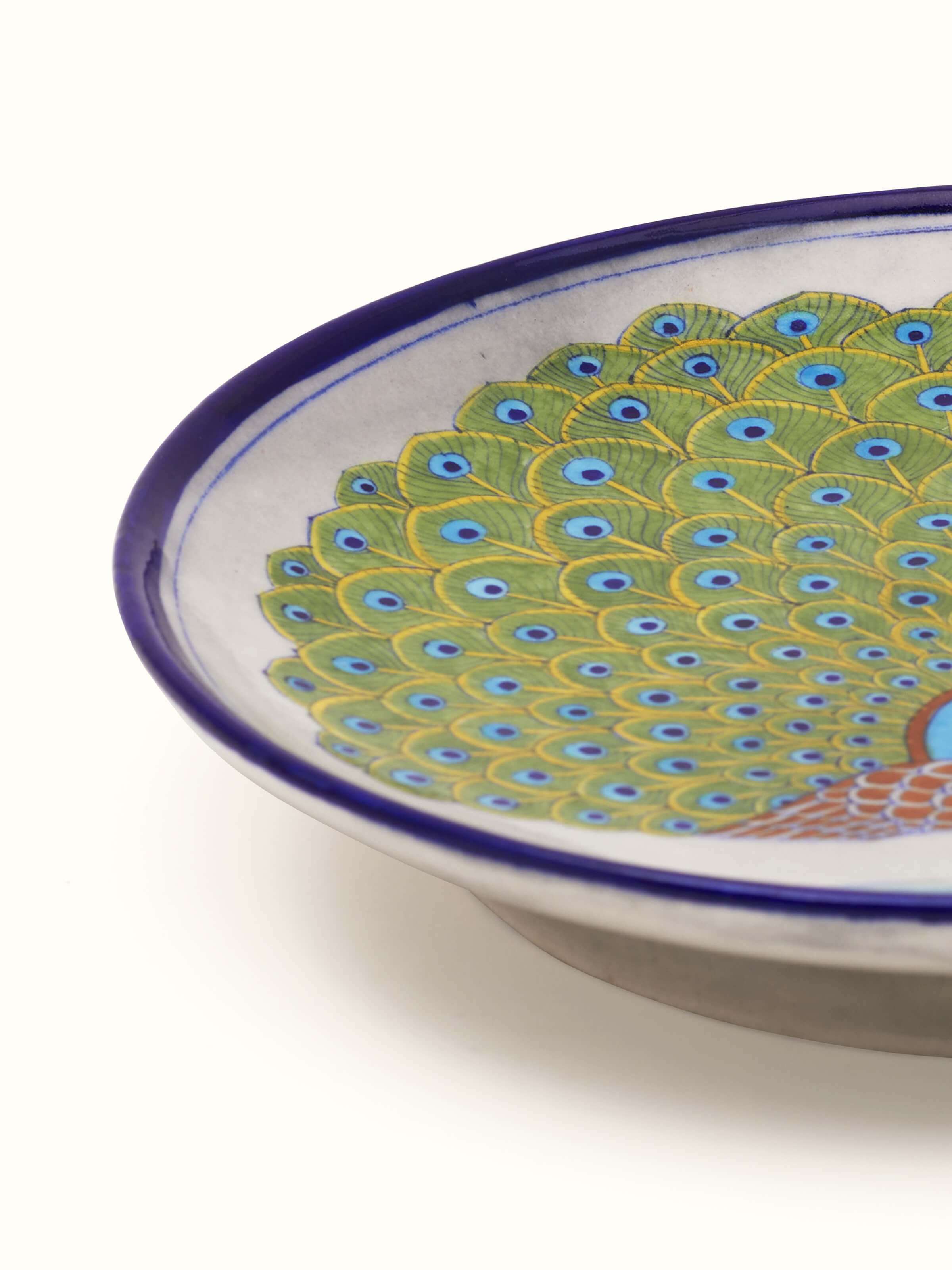 Detailed view of Blue pottery peacock display plate